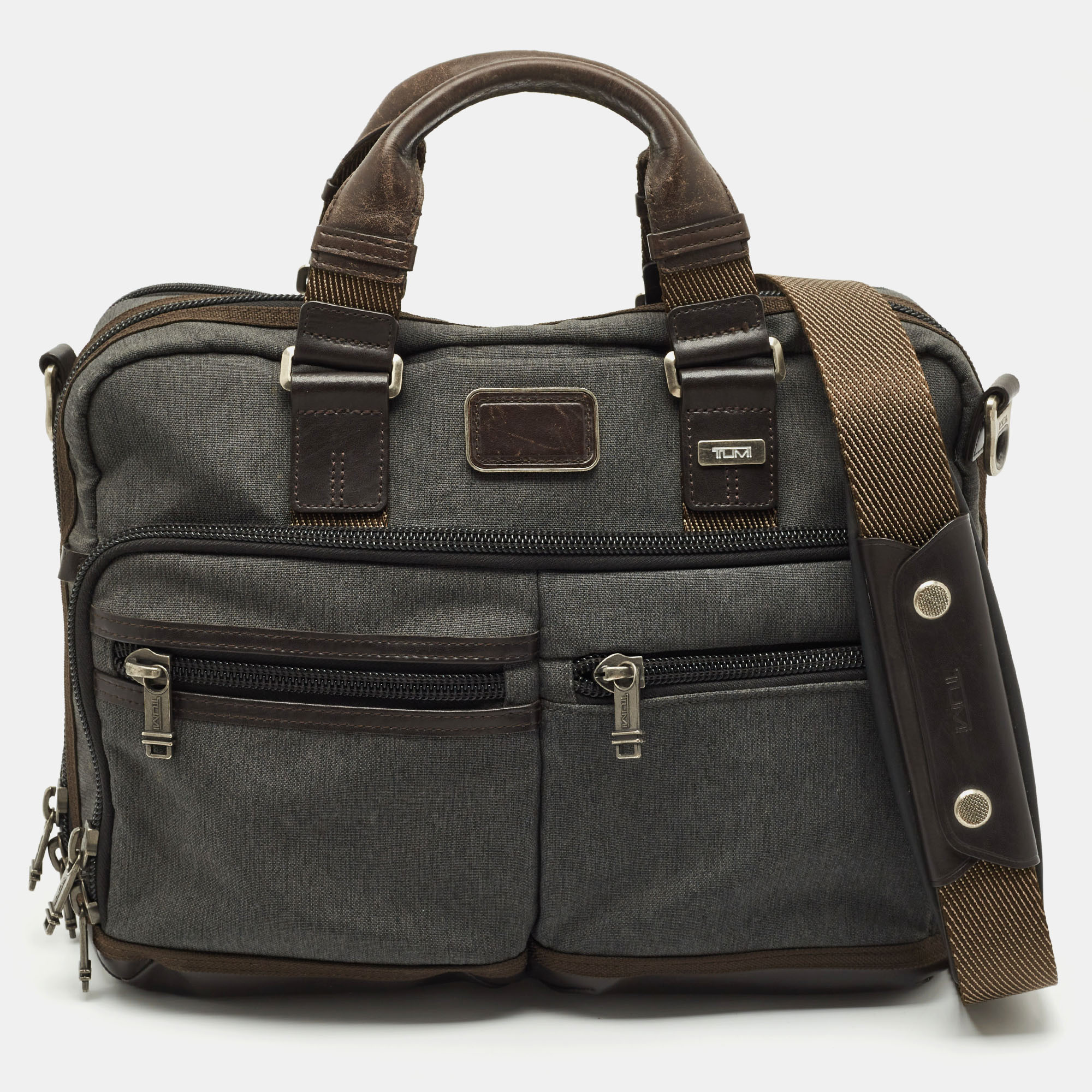 Tumi Grey/Brown Canvas and Leather Andersen Slim Commuter Briefcase Bag
Tumi Grey/Brown Canvas and Leather Andersen Slim Commuter Briefcase Bag