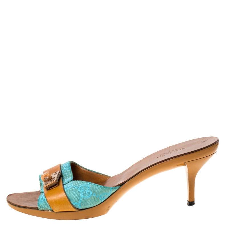 Gucci Brown/Blue GG Canvas and Leather Turnlock Detail Slides Sandals Size
Gucci Brown/Blue GG Canvas and Leather Turnlock Detail Slides Sandals Size