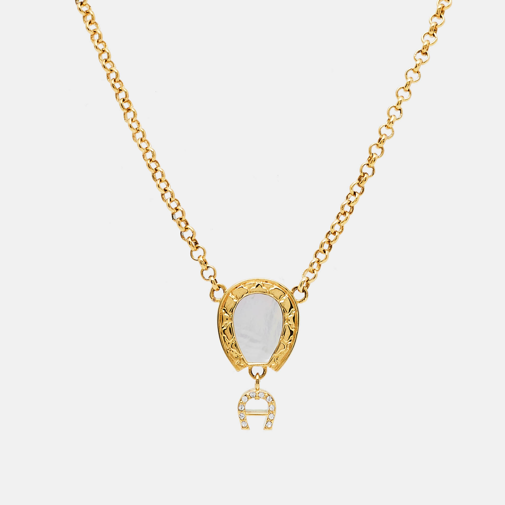 Aigner gold tone mother of pearl crystal logo pendant necklace