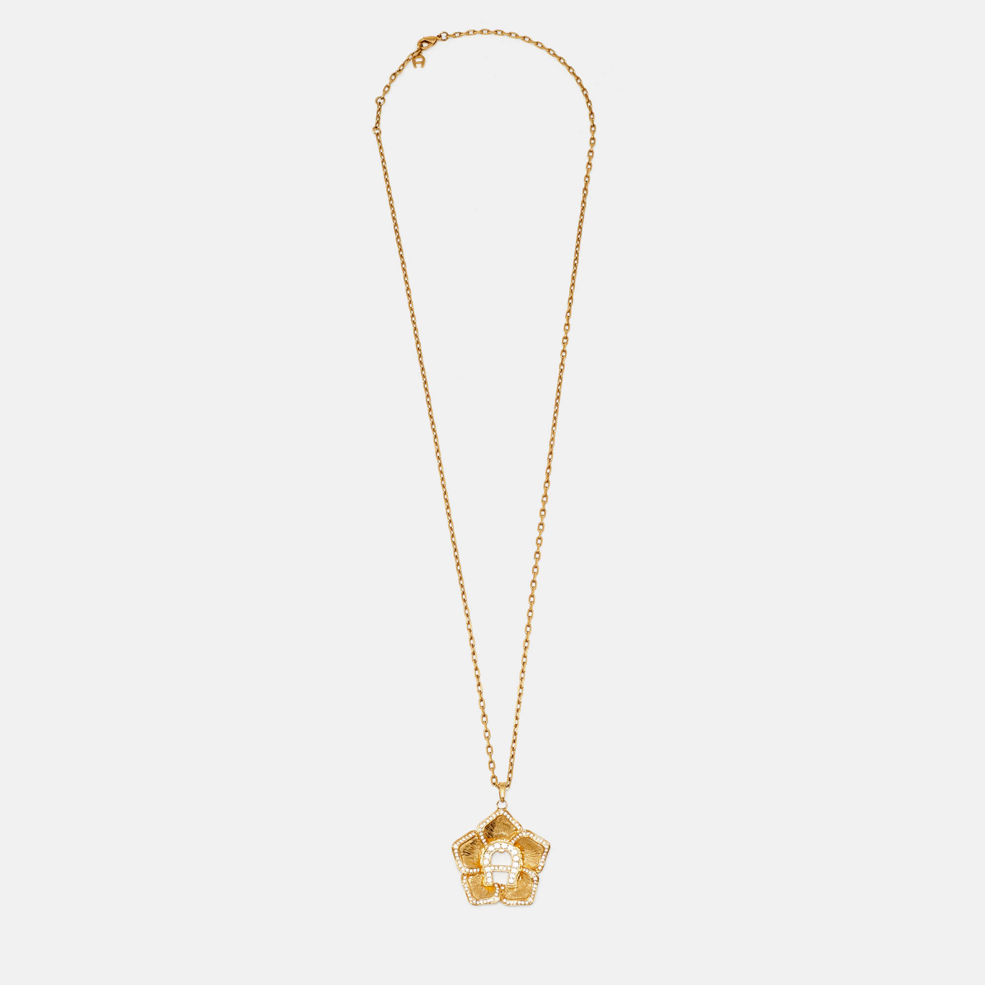 Aigner Gold Tone Crystal Logo Flower Pendant Necklace