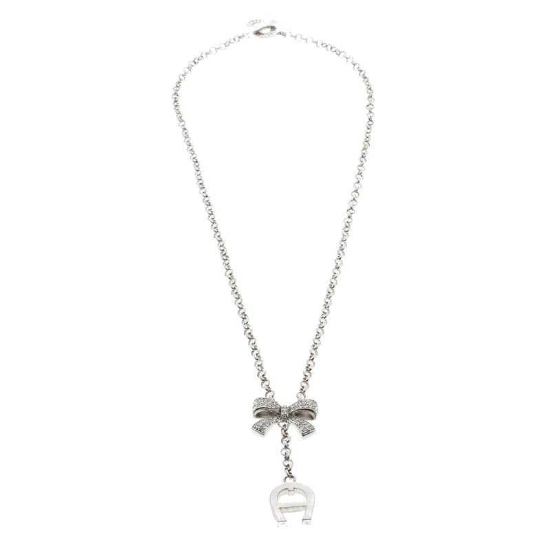 Aigner Crystal Studded Bow Silver Tone Long Toggle Necklace