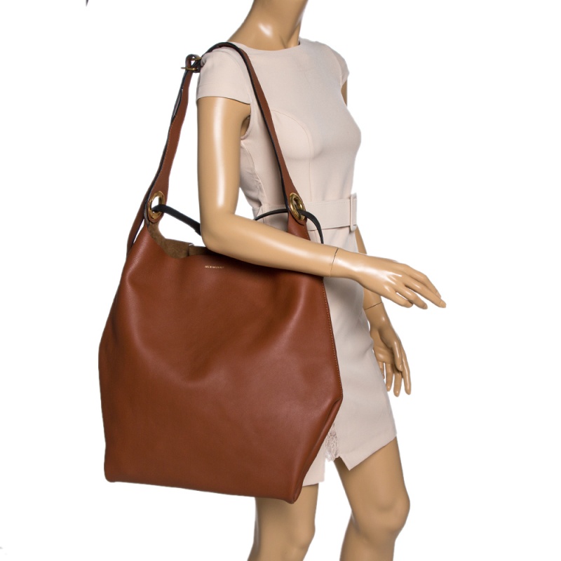 Burberry Tan Leather Medium Grommet Hobo
Burberry Tan Leather Medium Grommet Hobo