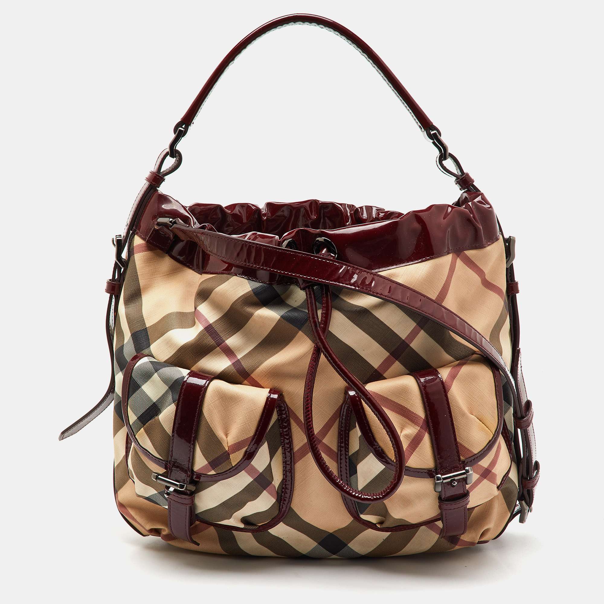 Burberry Beige/Burgundy Nova Check PVC and Patent Leather Drawstring Hobo
Burberry Beige/Burgundy Nova Check PVC and Patent Leather Drawstring Hobo