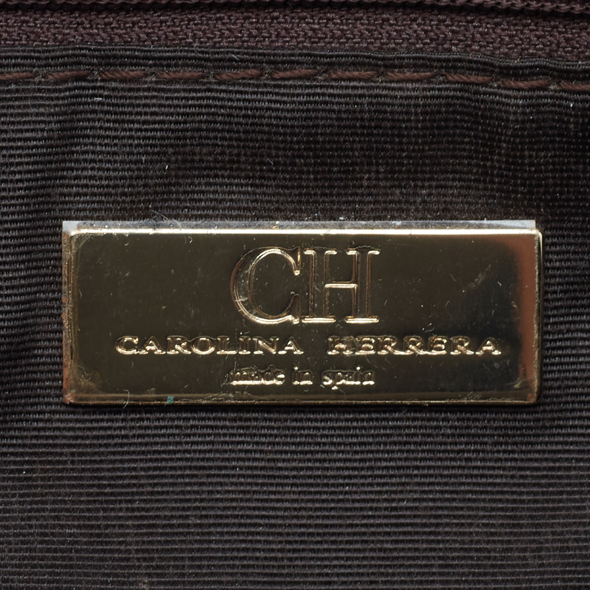 Carolina Herrera Metallic Monogram Embossed Leather Audrey Clutch