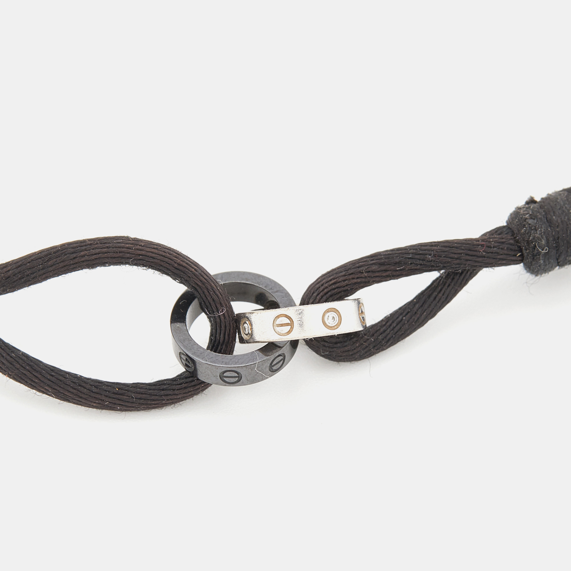 Cartier Love Interlocking Loop Diamond Black Ceramic 18k White Gold Adjustable Cord Bracelet 
Cartier Love Interlocking Loop Diamond Black Ceramic 18k White Gold Adjustable Cord Bracelet