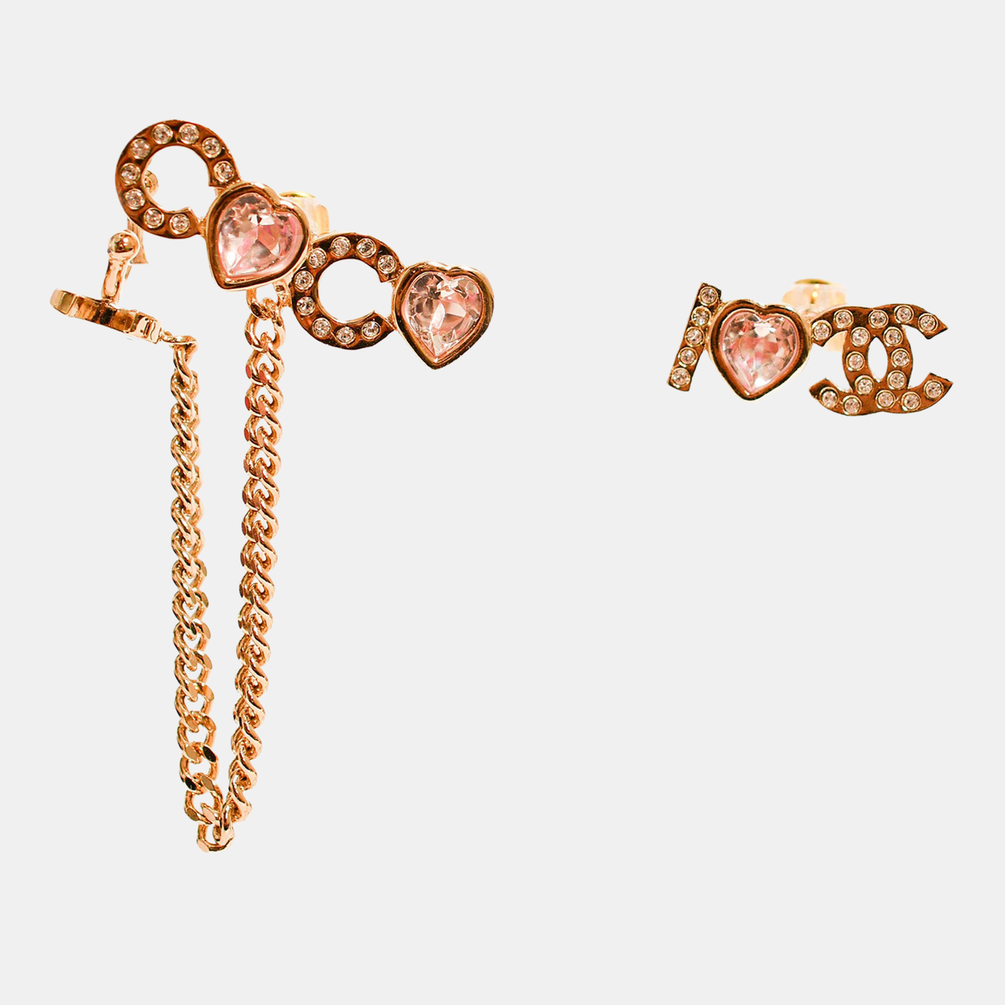 Chanel 2022 Gold Toned 'I Heart Coco' Pink Crystal Embellished Stud Earrings with Ear Cuff
Chanel 2022 Gold Toned 'I Heart Coco' Pink Crystal Embellished Stud Earrings with Ear Cuff