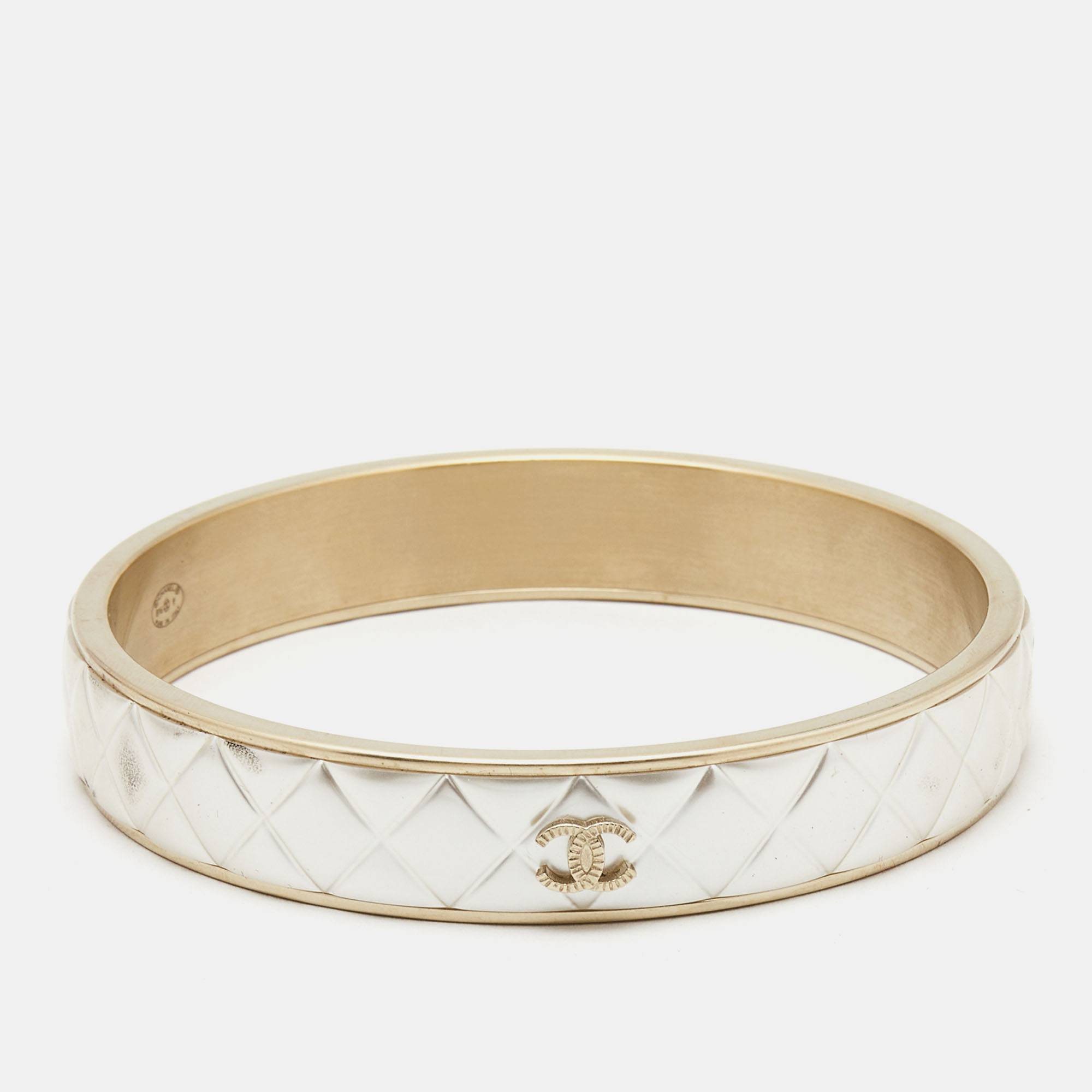 Chanel cc composite gold tone bangle bracelet