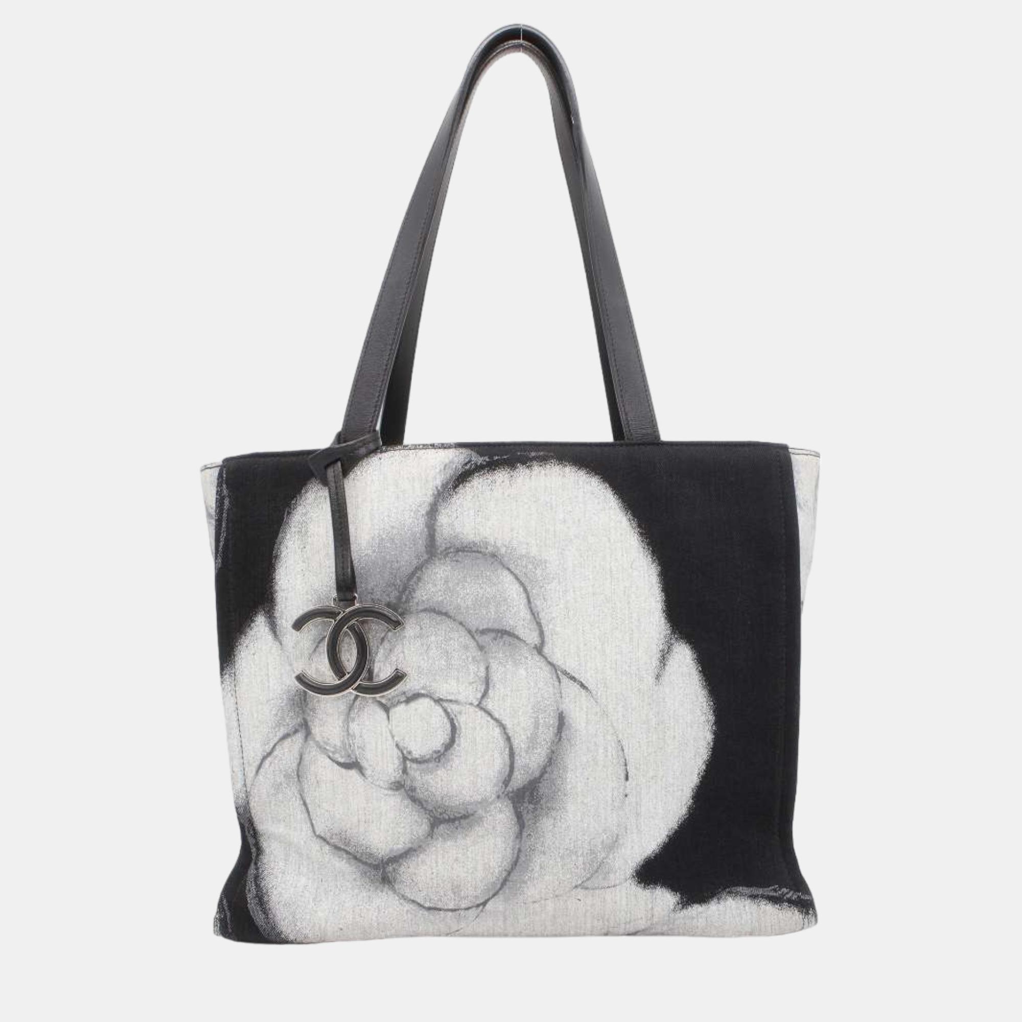 Chanel black printed canvas and leather camellia tote bag