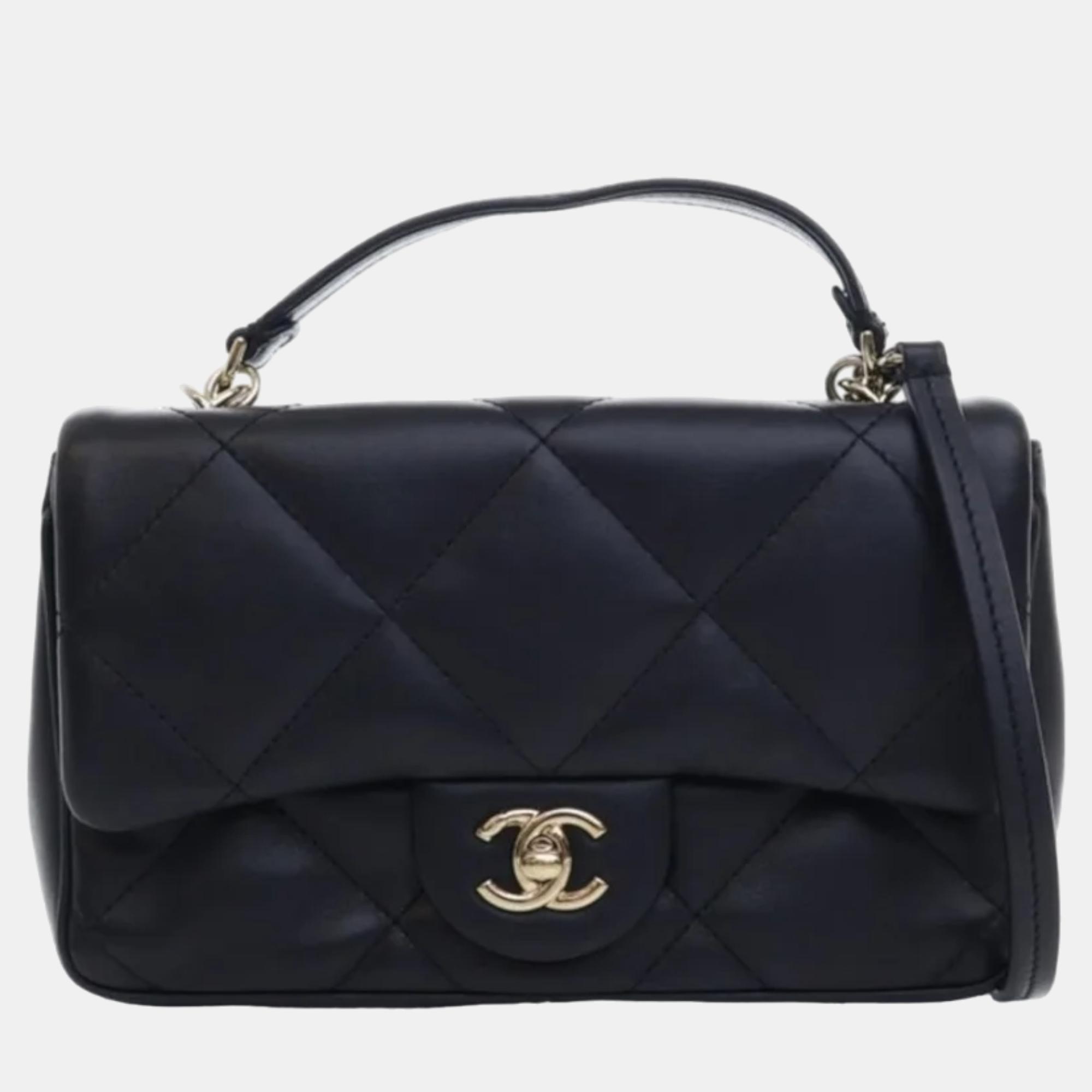Chanel black quilted lambskin mini classic single flap top handle bag