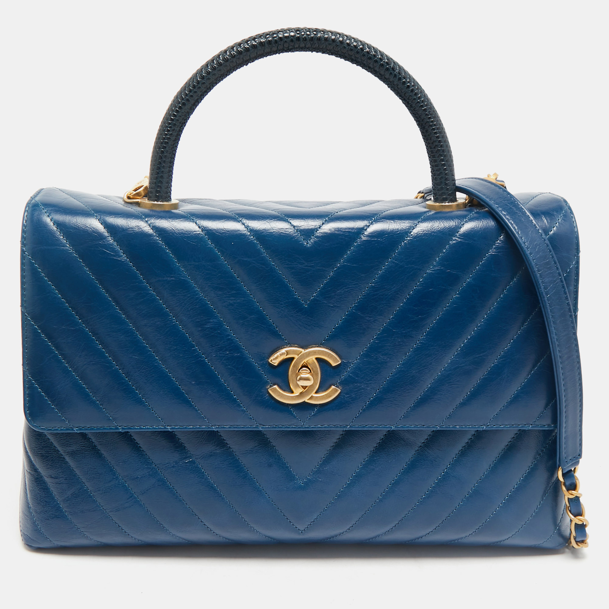 Chanel Blue Chevron Quilted Leather and Lizard Coco Top Handle Bag
Chanel Blue Chevron Quilted Leather and Lizard Coco Top Handle Bag