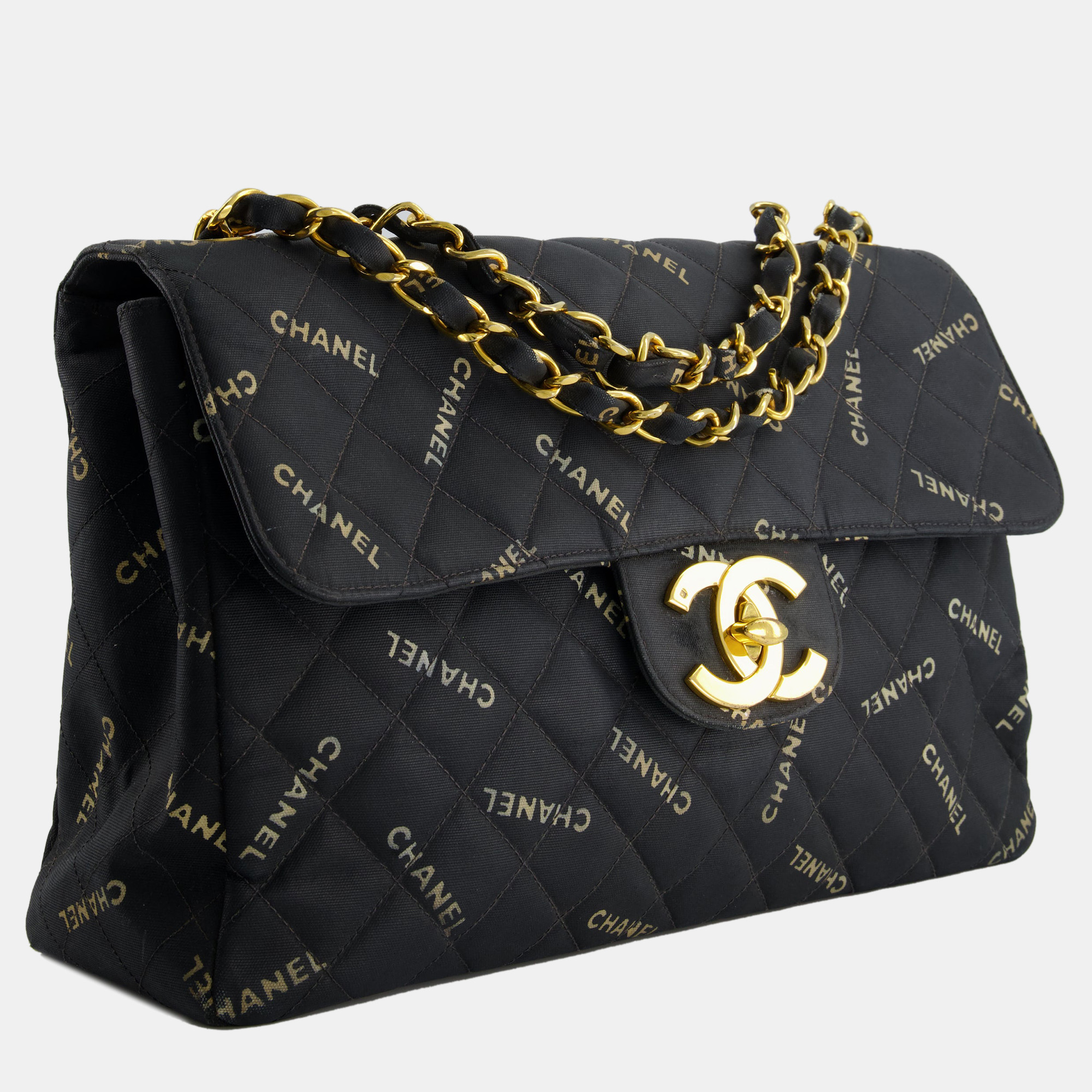 Chanel Black Vintage Single Flap Bag in Quilted Canvas Logo Print with 24K Gold Hardware
Chanel Black Vintage Single Flap Bag in Quilted Canvas Logo Print with 24K Gold Hardware