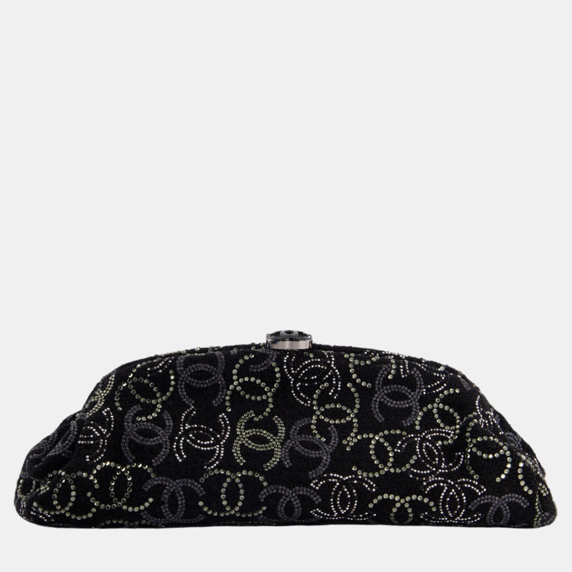 Chanel black timeless clutch bag in fabric with gunmetal hardware and crystal logo details