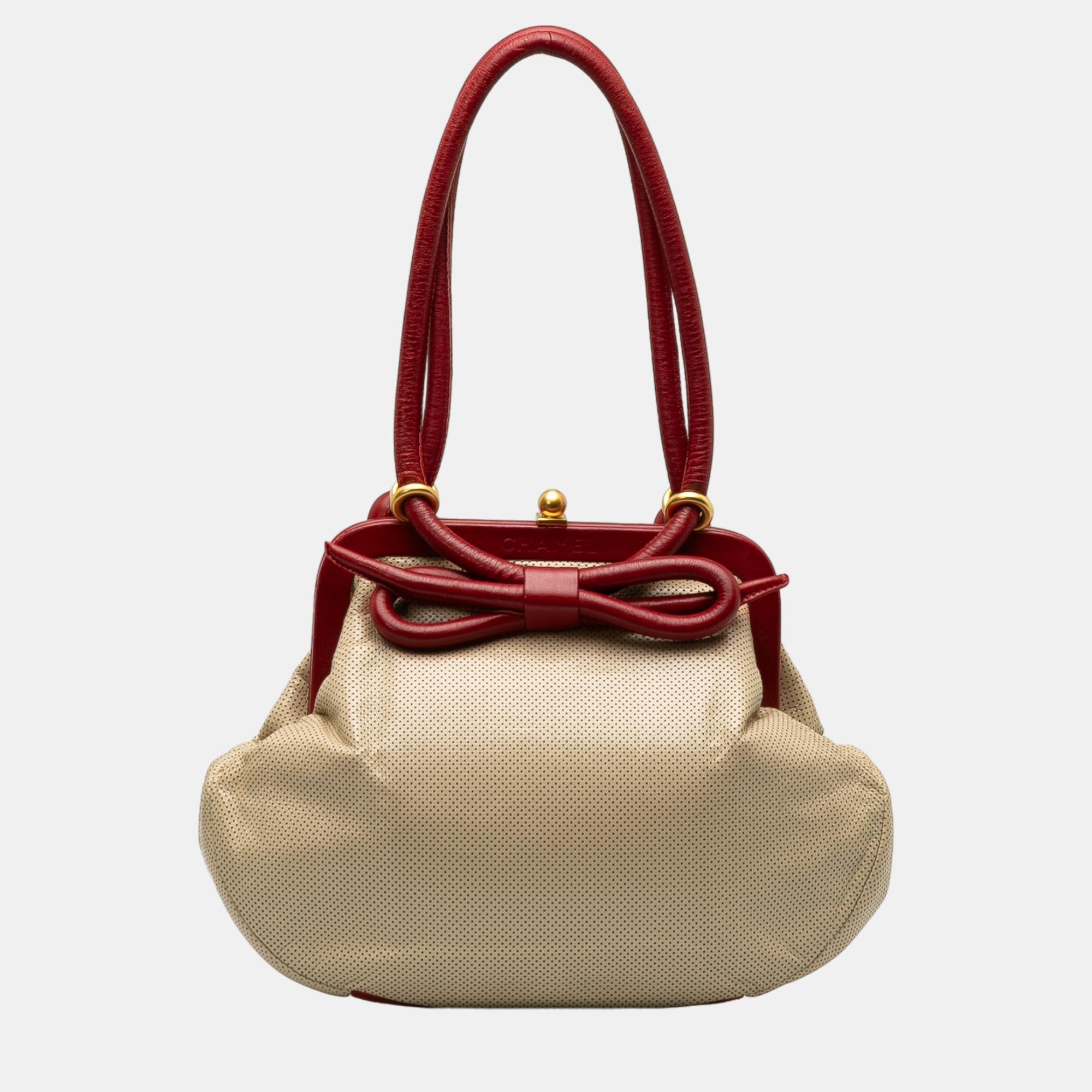 Chanel beige perforated bow frame handbag