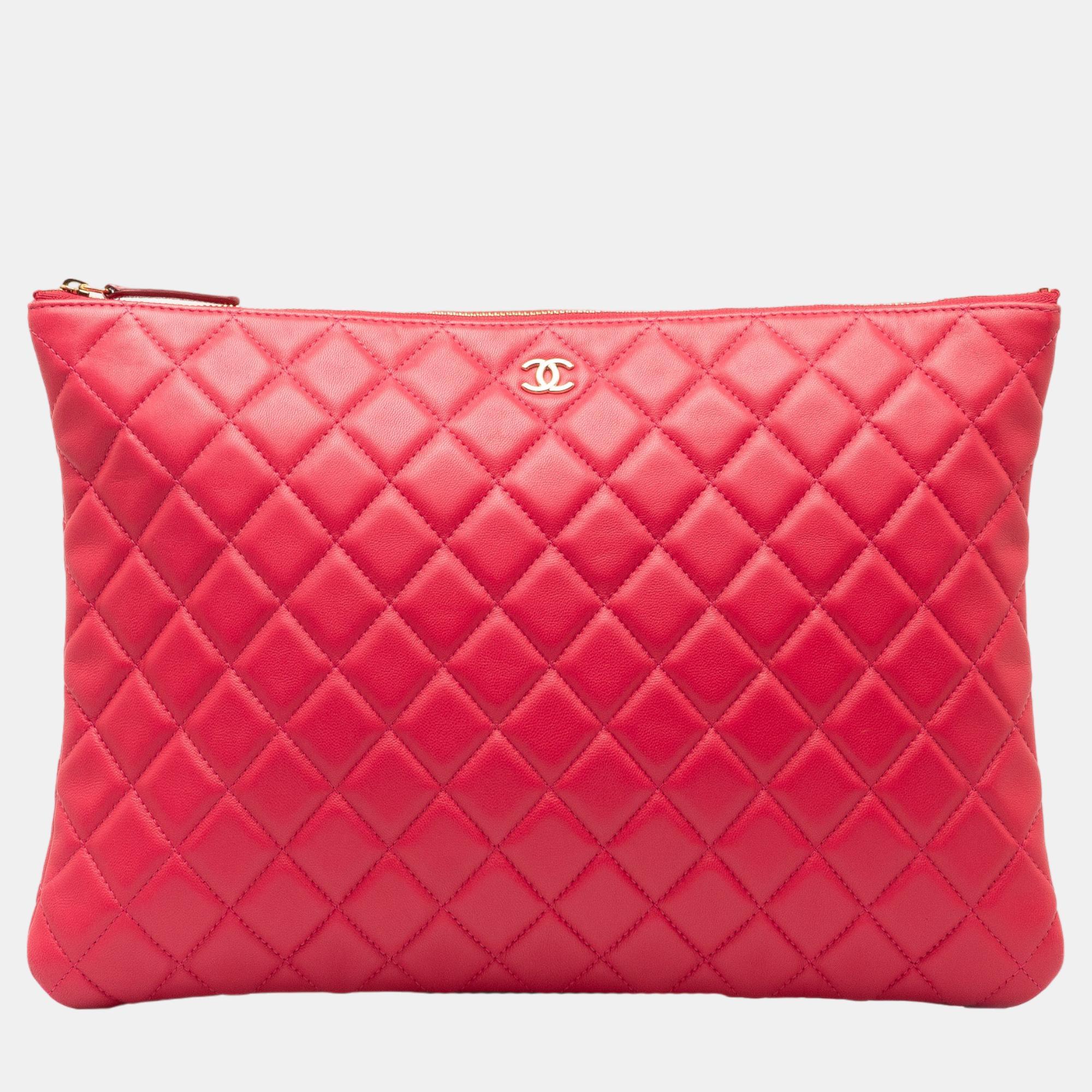 Chanel pink quilted o case clutch