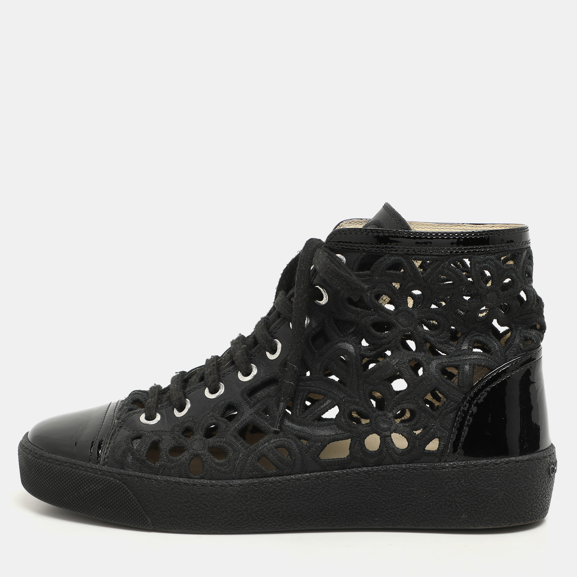 Chanel Black Cut Out Leather CC Cap Toe High Top Sneakers Size 36.5
Chanel Black Cut Out Leather CC Cap Toe High Top Sneakers Size 36.5