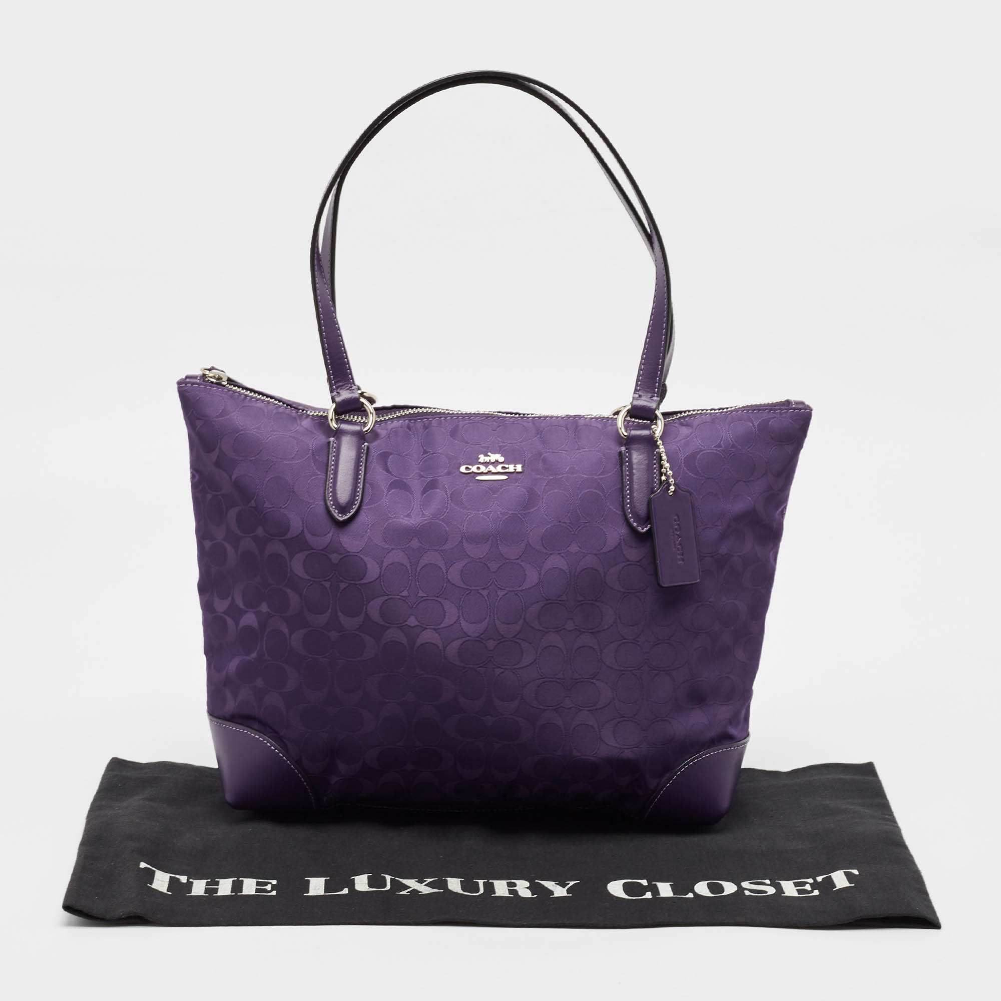 Coach Purple Signature Nylon And Leather Zip Top Tote