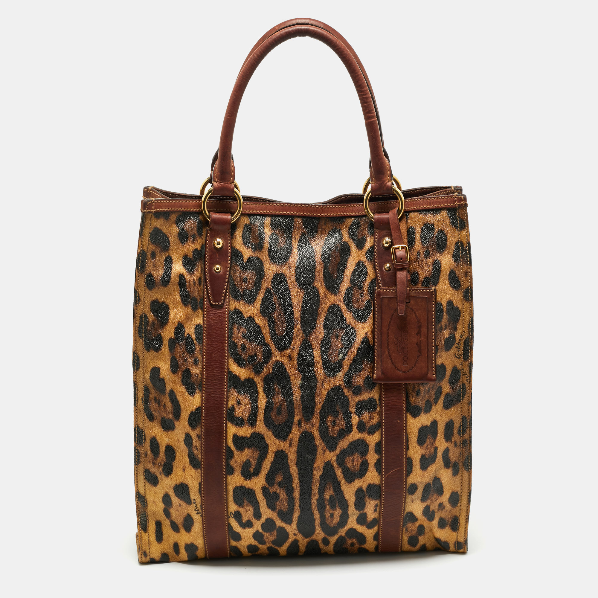 Dolce & Gabbana Brown Leopard Print Coated Canvas and Leather Shopper Tote
Dolce & Gabbana Brown Leopard Print Coated Canvas and Leather Shopper Tote