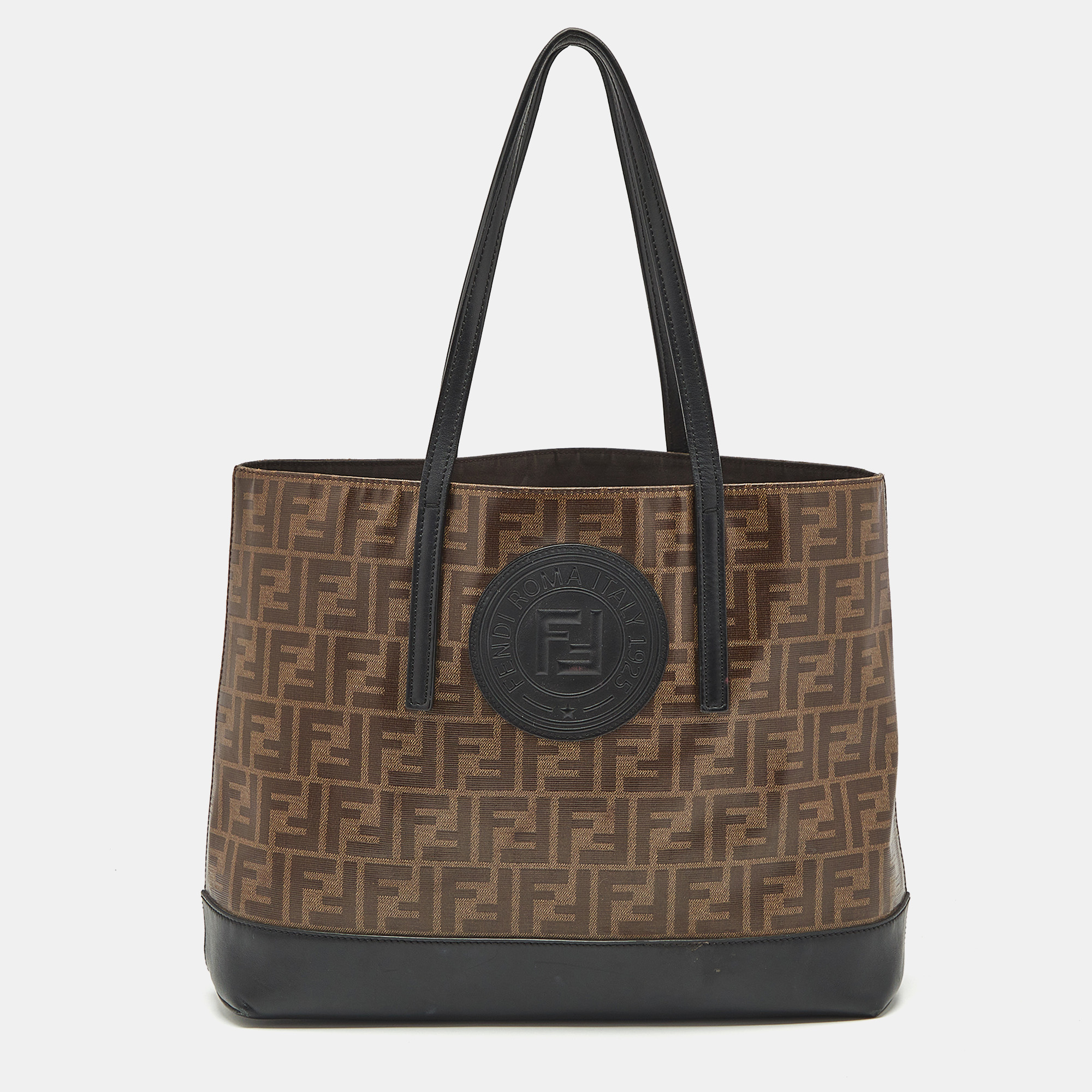Fendi Brown/Black Zucca Coated Canvas and Leather FF 1974 Stamp Patch Shopper Tote
Fendi Brown/Black Zucca Coated Canvas and Leather FF 1974 Stamp Patch Shopper Tote