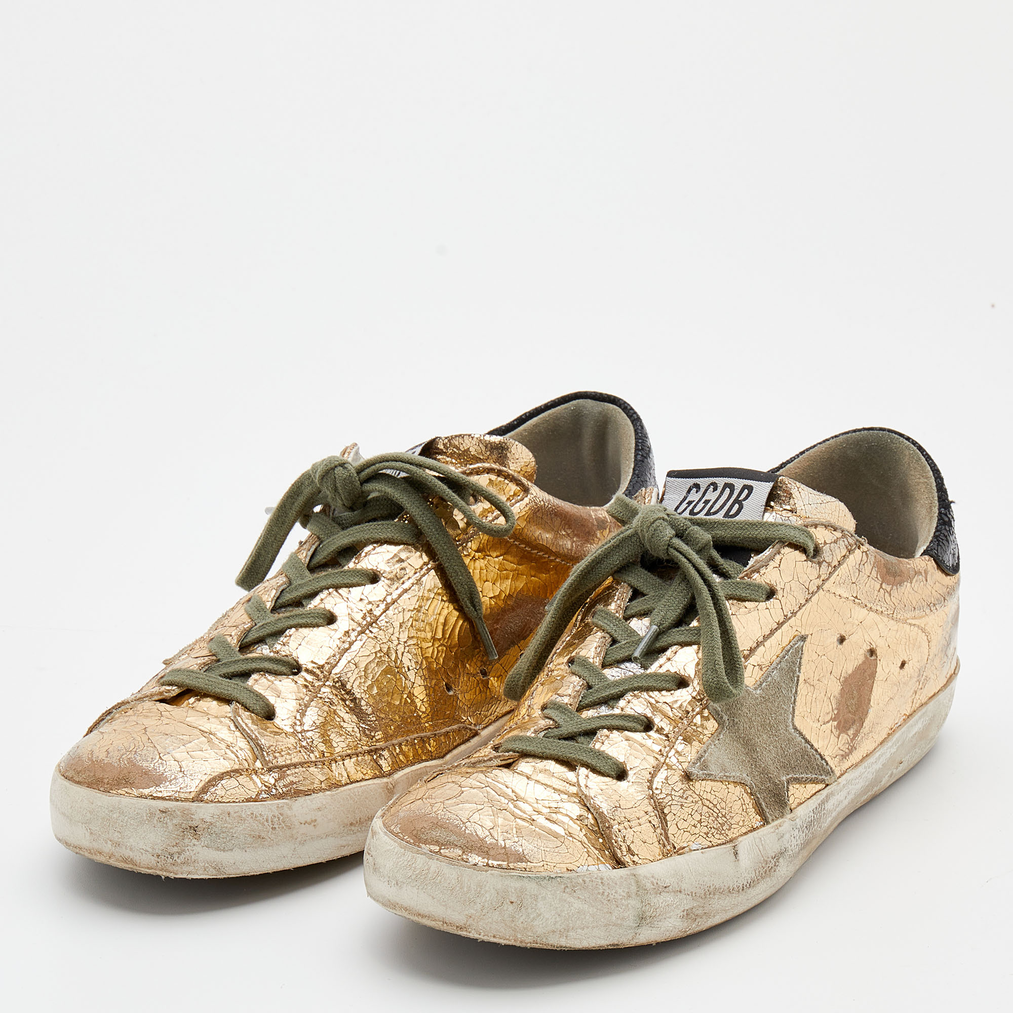 

Golden Goose Gold Laminated Leather And Suede Superstar Sneakers Size