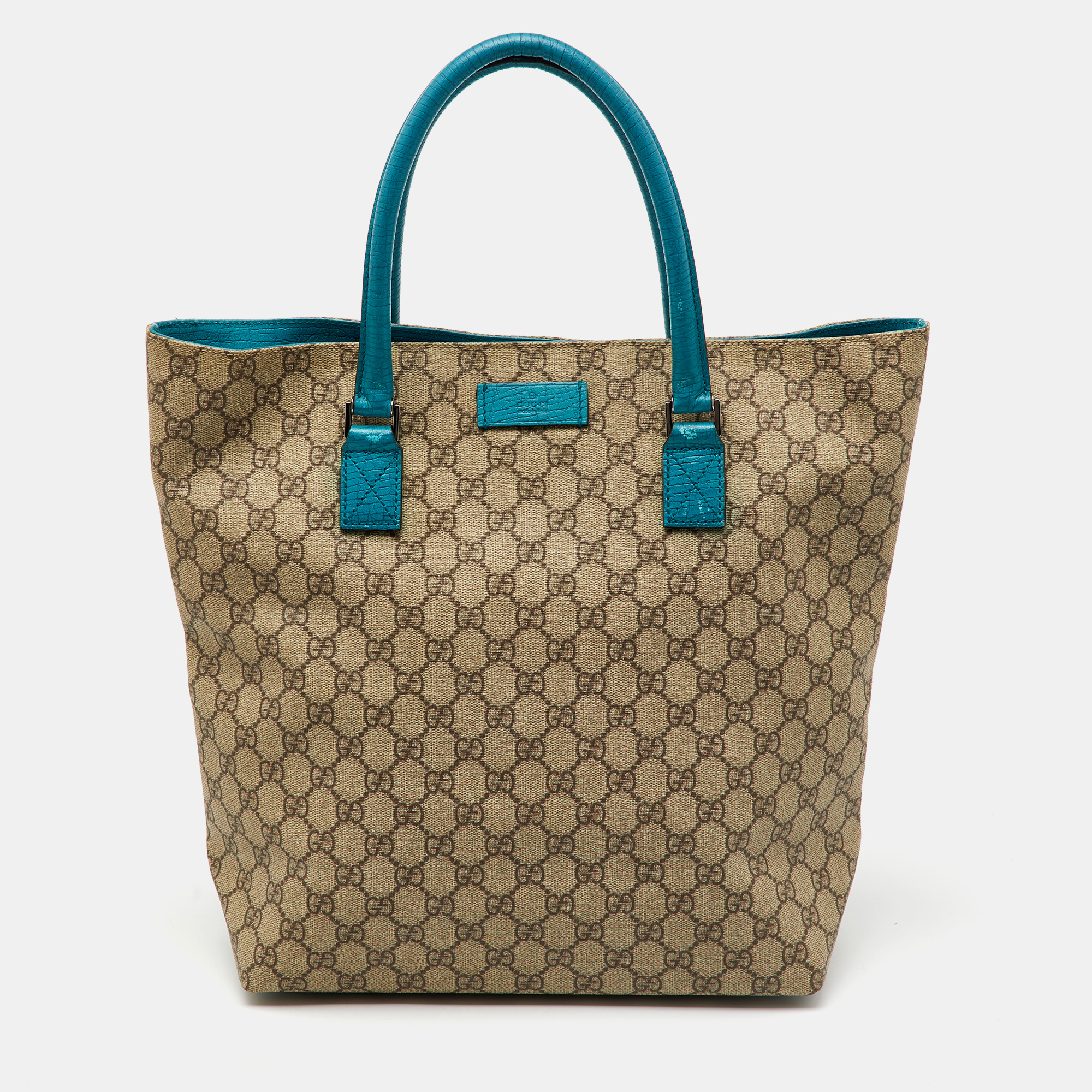 Gucci Beige/Teal Blue GG Supreme Canvas and Leather Vertical Tote
Gucci Beige/Teal Blue GG Supreme Canvas and Leather Vertical Tote