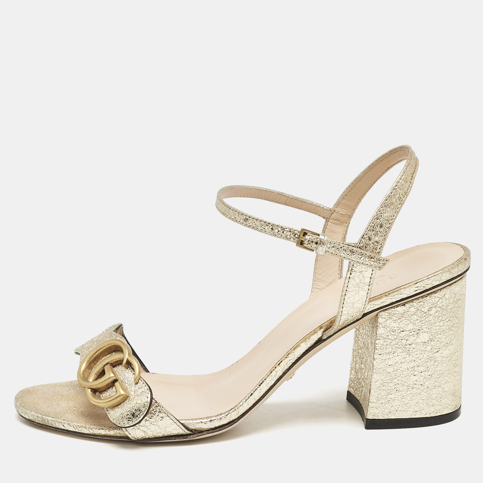 Gucci Metallic Gold Leather GG Marmont Block Heel Ankle Strap Sandals Size
Gucci Metallic Gold Leather GG Marmont Block Heel Ankle Strap Sandals Size