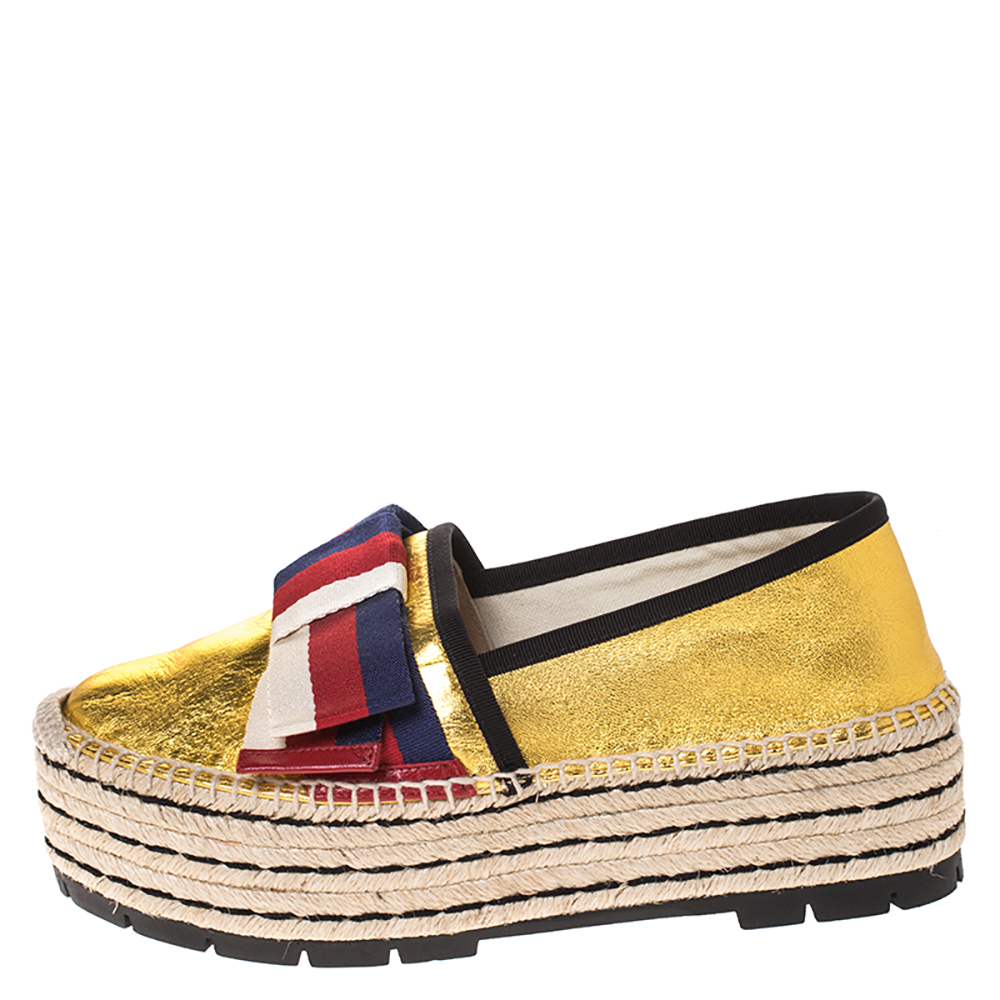 Gucci Metallic Gold Leather Sylvie Web Bow Espadrille Platform Flats Size
Gucci Metallic Gold Leather Sylvie Web Bow Espadrille Platform Flats Size