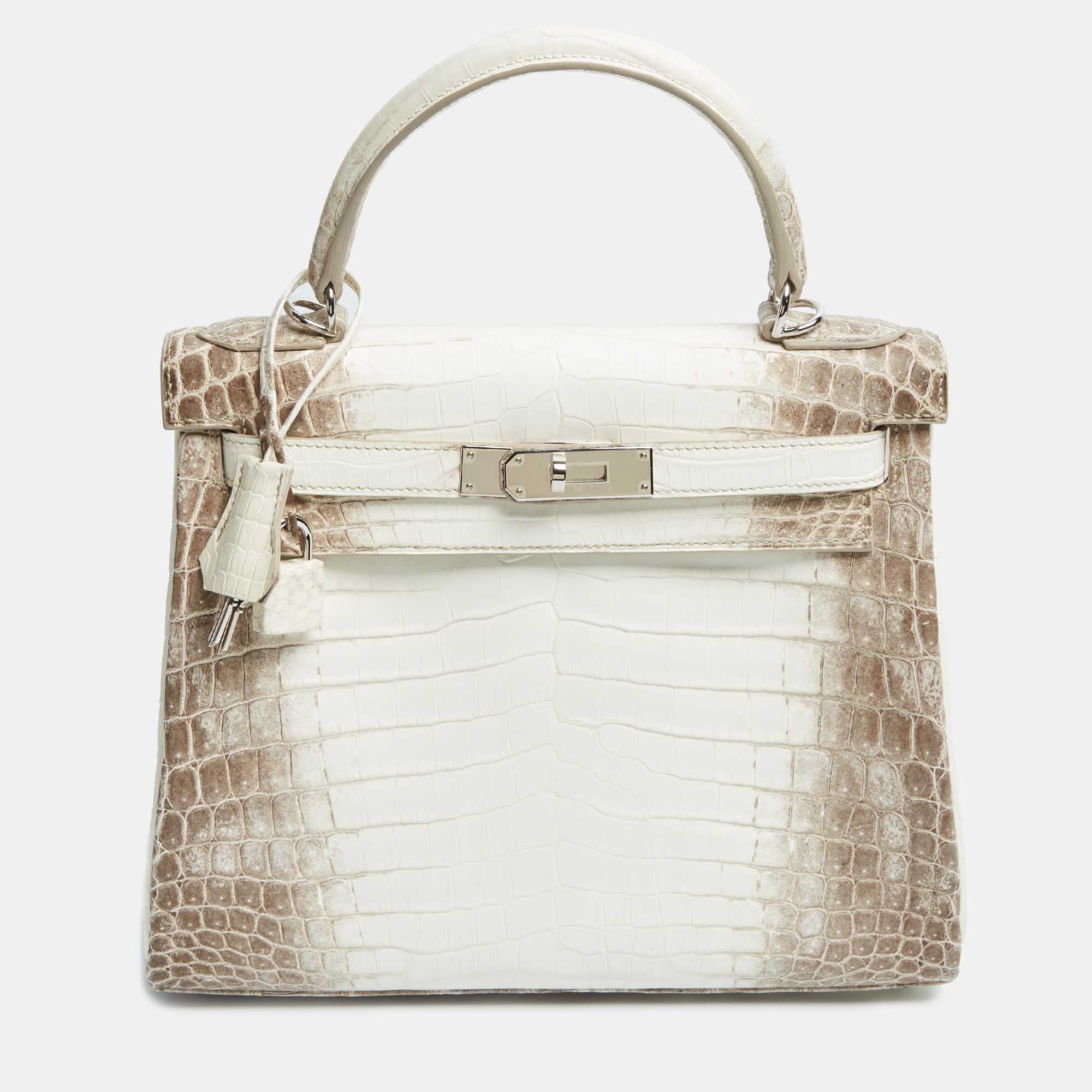 Hermès Blanc Crocodile Niloticus Himalaya Palladium Finish Kelly Retourne 28 Bag, White
Hermès Blanc Crocodile Niloticus Himalaya Palladium Finish Kelly Retourne 28 Bag, White