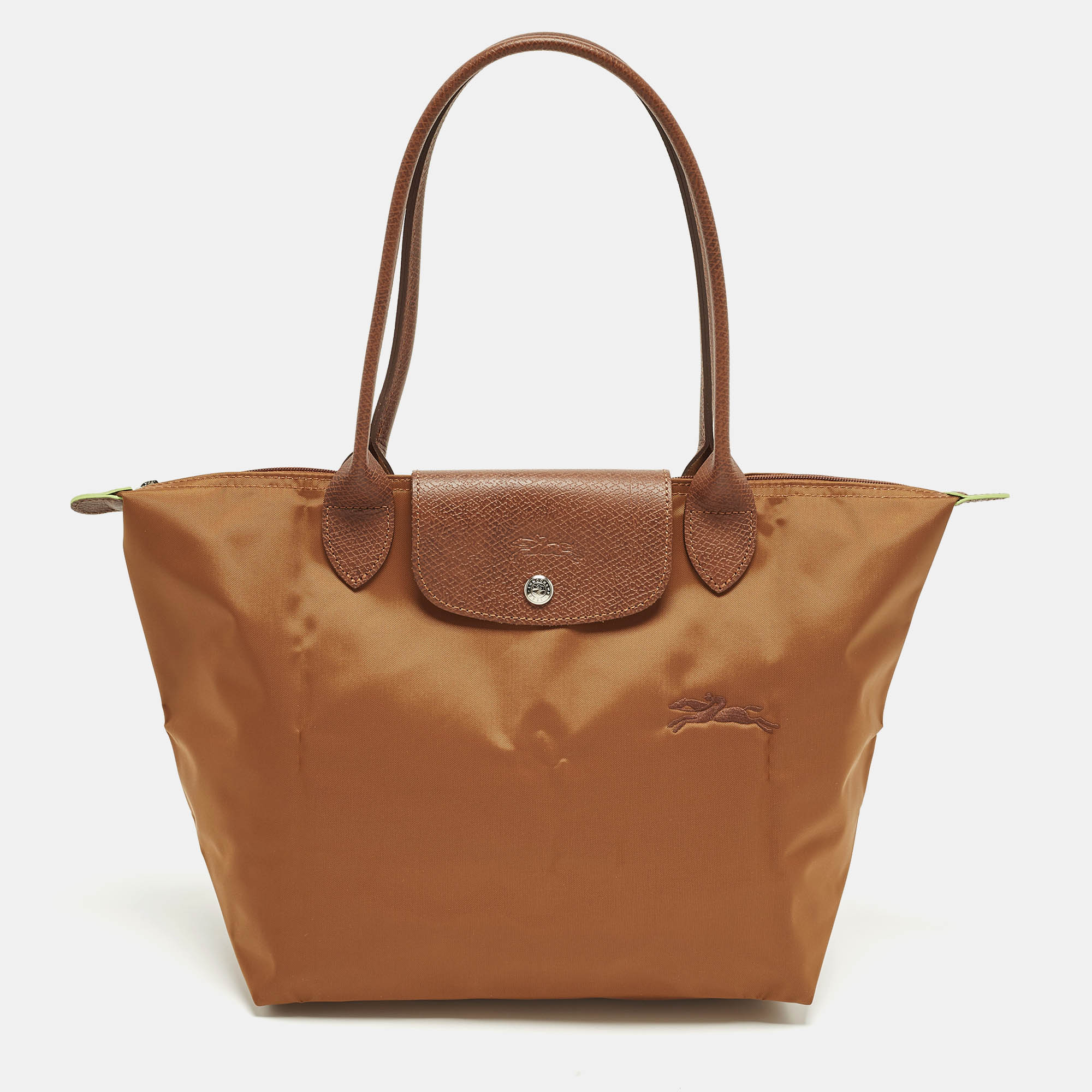 Longchamp Le Pliage Long Handle Brown Leather and Nylon Tote
Longchamp Le Pliage Long Handle Brown Leather and Nylon Tote