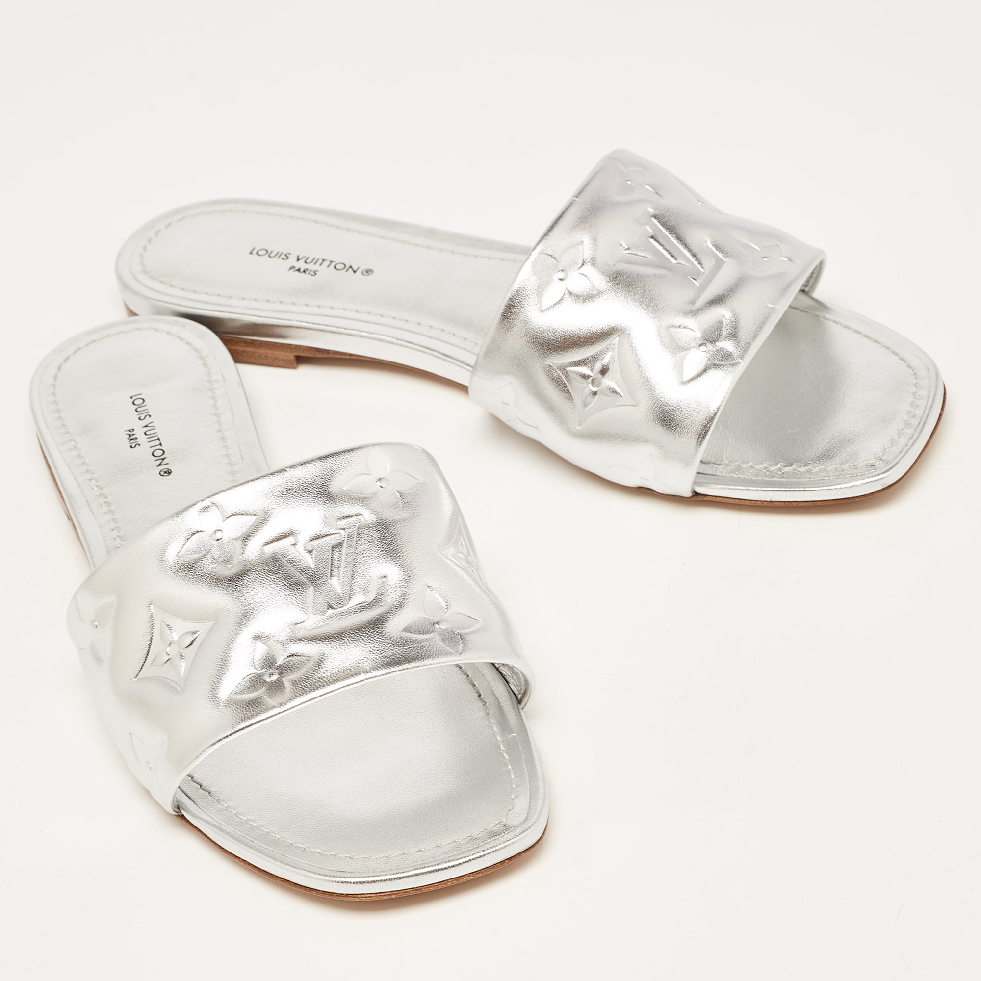 Louis Vuitton Silver Monogram Embossed Leather Revival Flat Slides Size 37