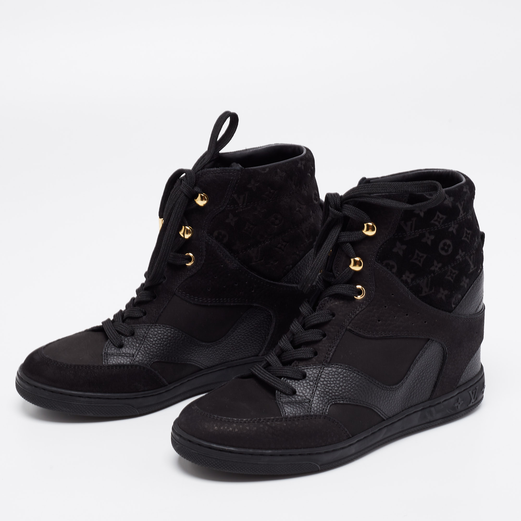 Louis Vuitton Black Monogram Empreinte Leather And Suede High Top Sneakers Size
Louis Vuitton Black Monogram Empreinte Leather And Suede High Top Sneakers Size