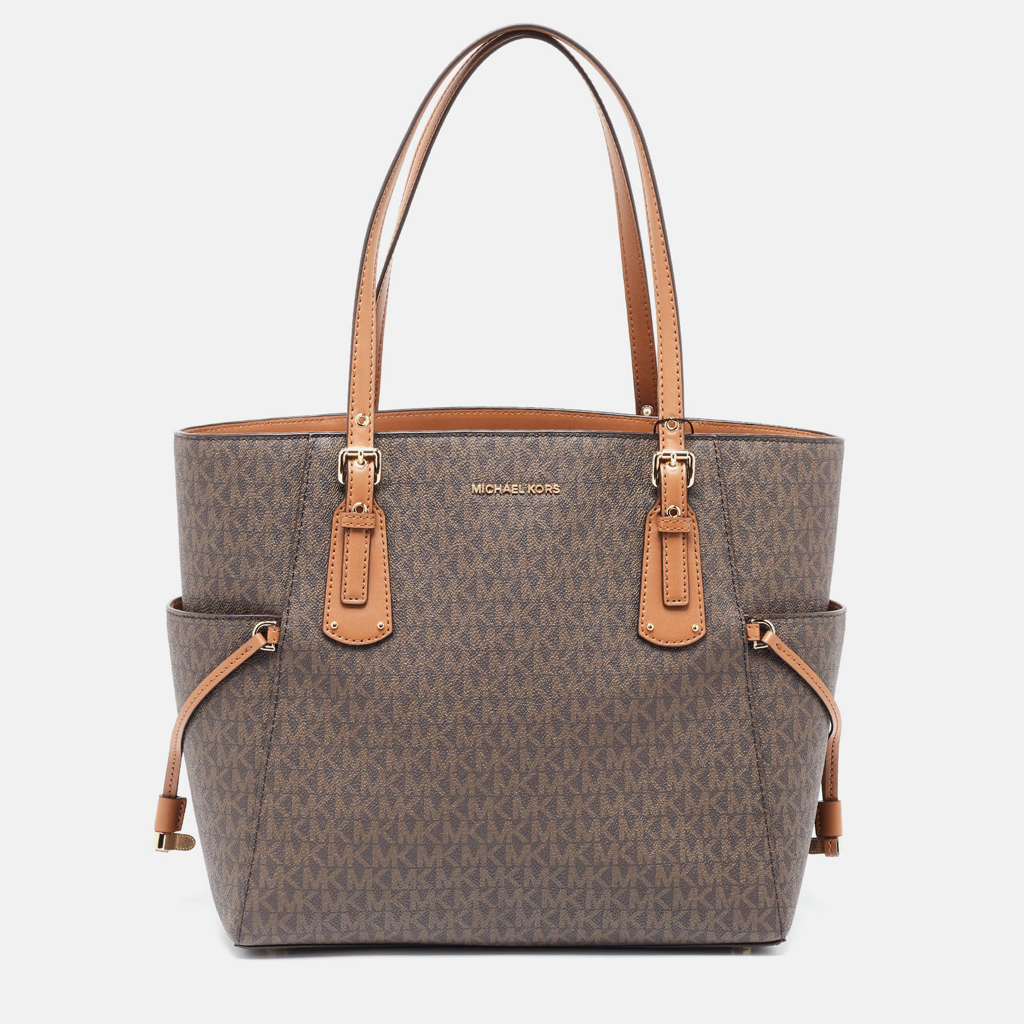 Michael kors brown/tan signature coated canvas and leather voyager tote