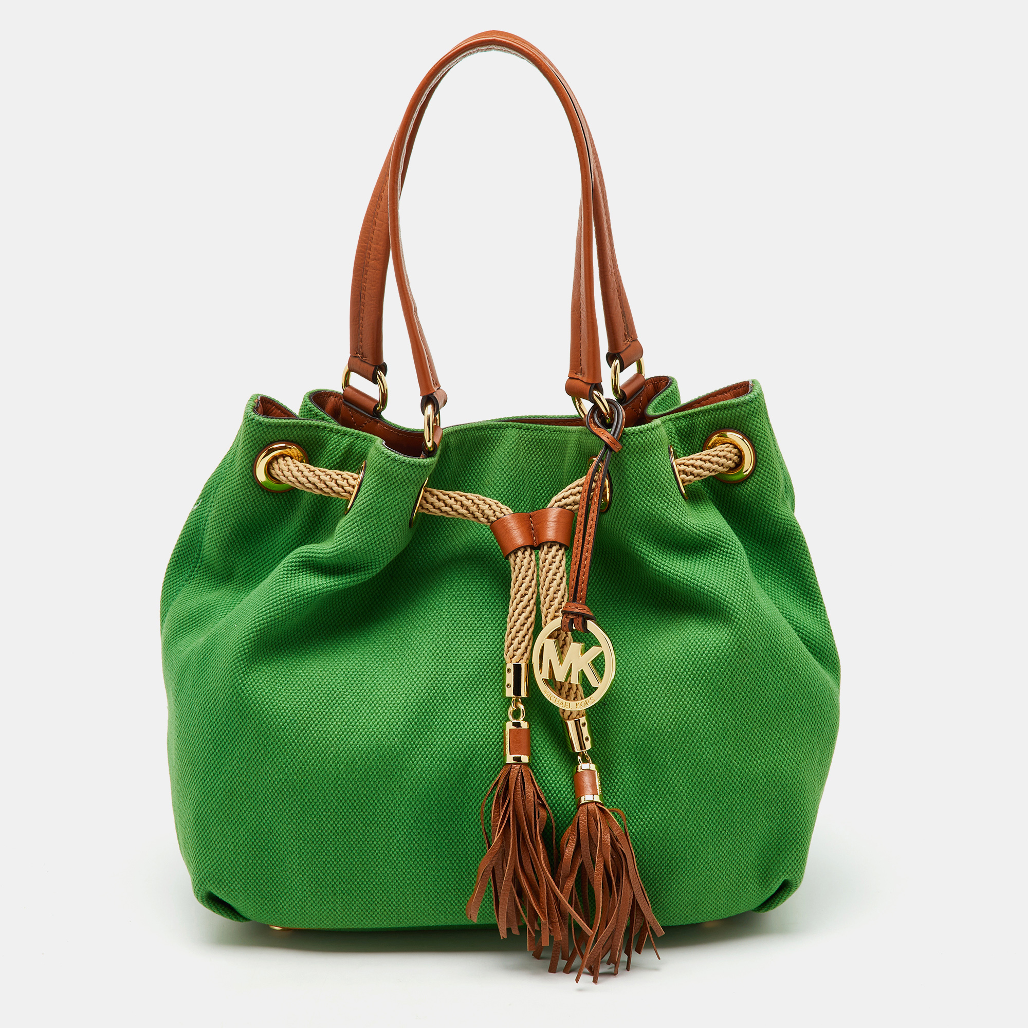 MICHAEL Michael Kors Green/Brown Canvas and Leather Marina Tassel Tote
MICHAEL Michael Kors Green/Brown Canvas and Leather Marina Tassel Tote