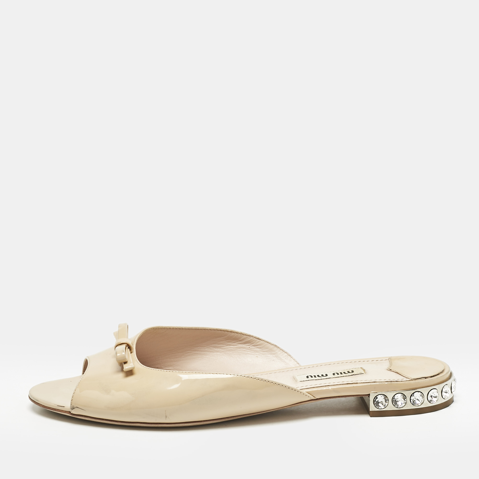 Miu Miu Beige Patent Leather Bow Crystal Embellished Heel Flat Slides Size
Miu Miu Beige Patent Leather Bow Crystal Embellished Heel Flat Slides Size