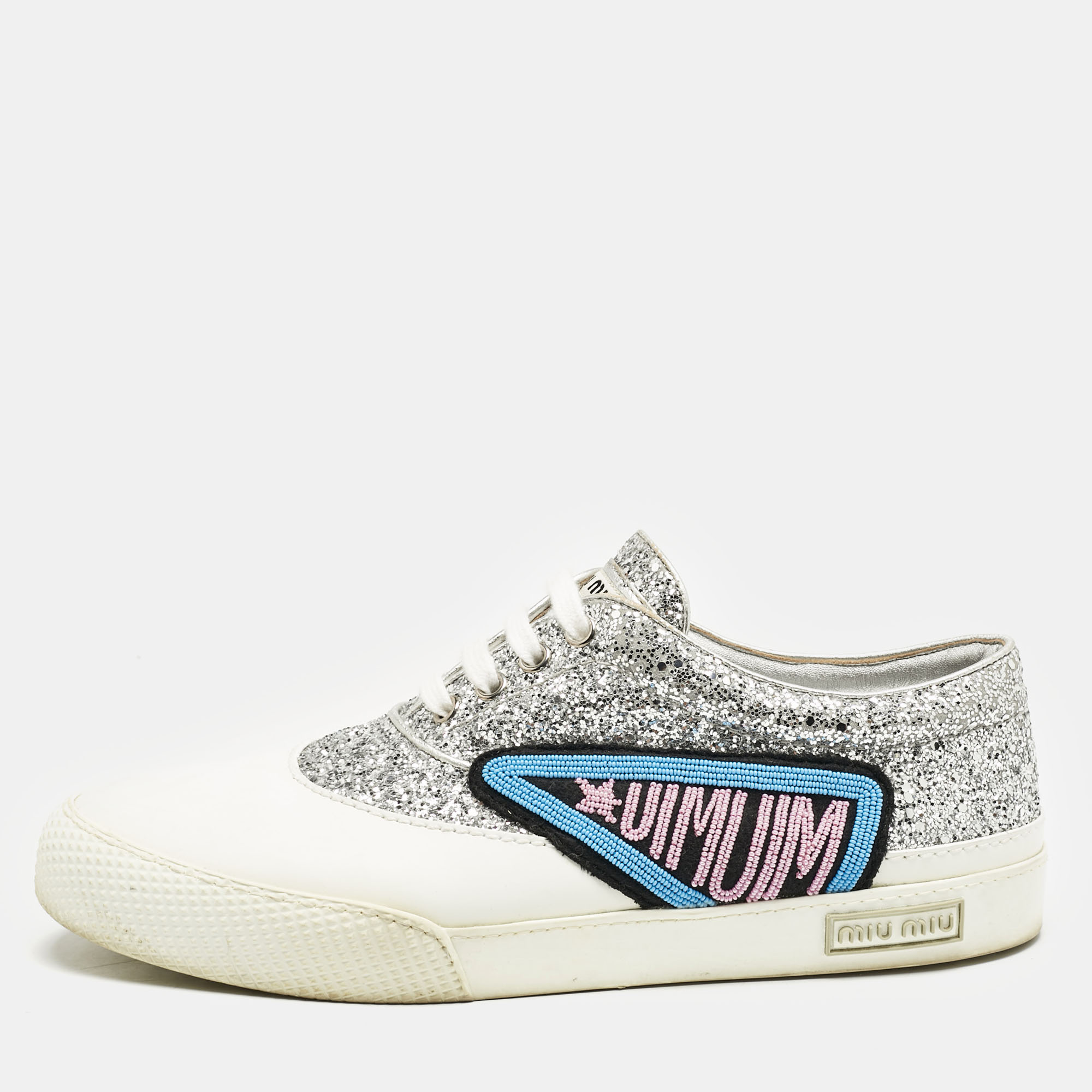 Miu Miu Silver/White Leather and Glitter Patch Slip on Sneakers Size
Miu Miu Silver/White Leather and Glitter Patch Slip on Sneakers Size
