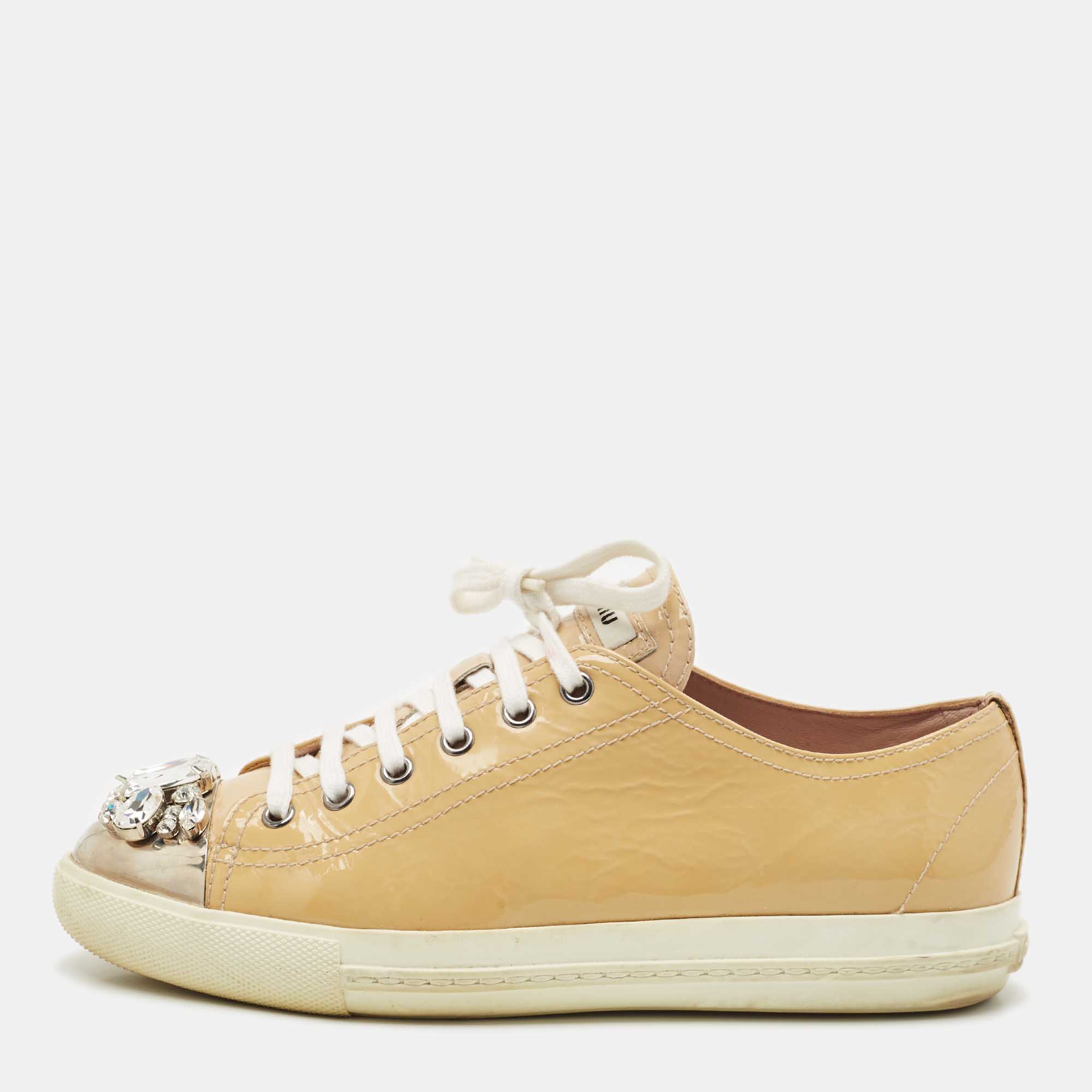 Miu Miu Beige Patent Leather Crystal Embellished Cap Toe Sneakers Size
Miu Miu Beige Patent Leather Crystal Embellished Cap Toe Sneakers Size
