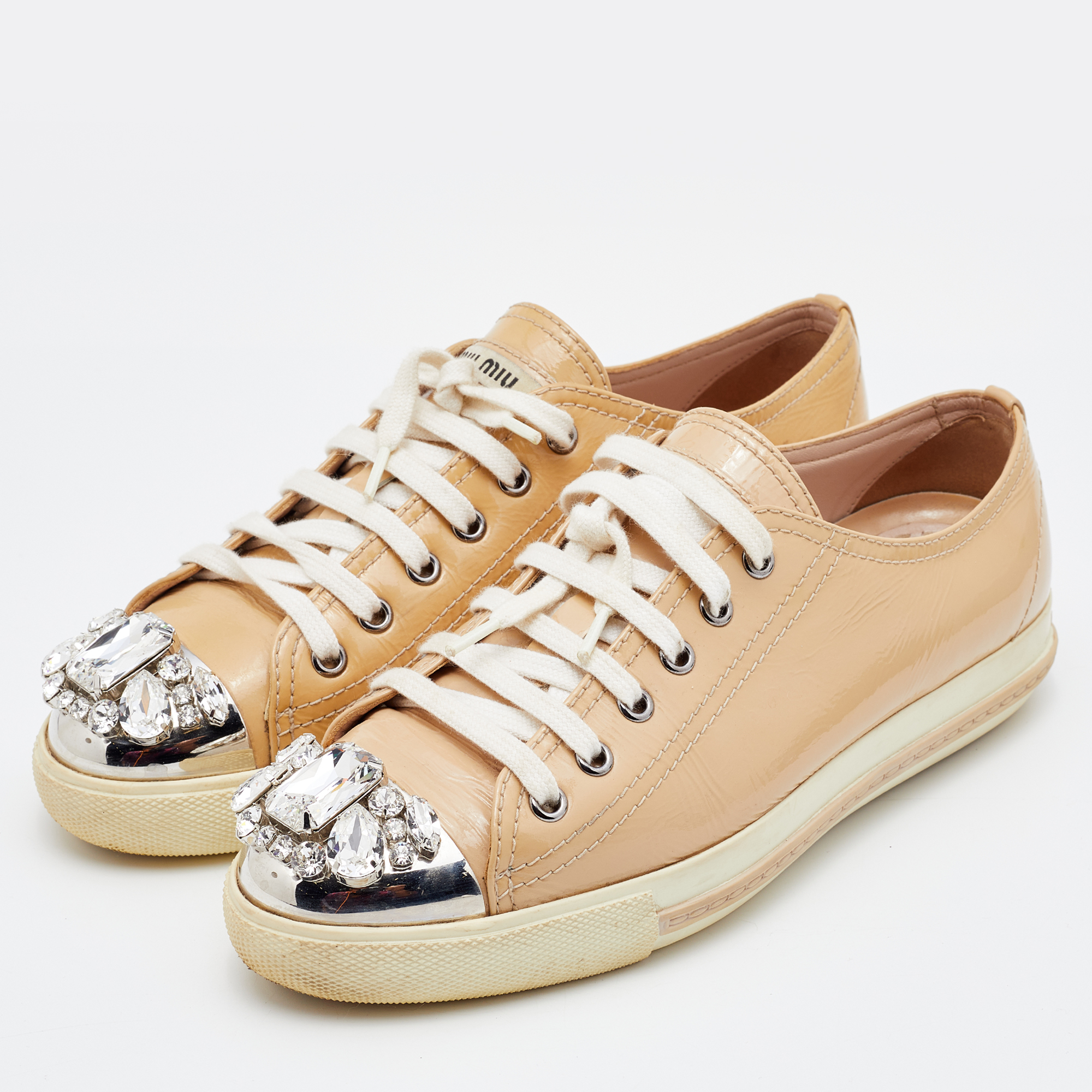 Miu Miu Beige Patent Leather Crystal Embellished Cap Toe Sneakers Size
Miu Miu Beige Patent Leather Crystal Embellished Cap Toe Sneakers Size