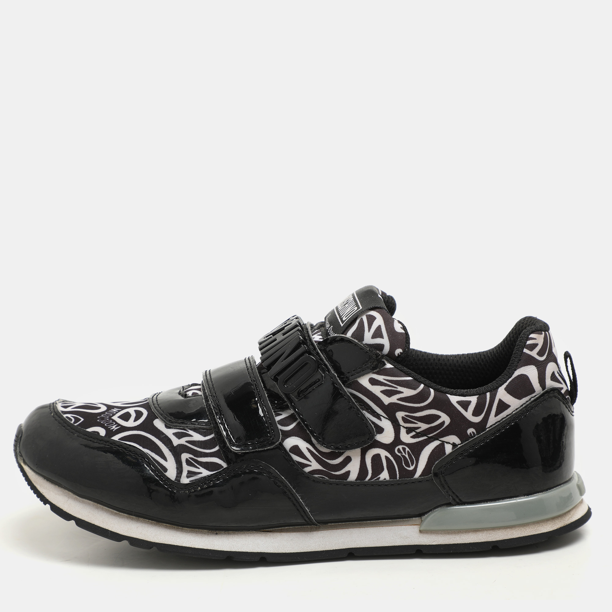Moschino Black/White Printed Neoprene and Patent Leather Velcro Low Top Sneakers Size
Moschino Black/White Printed Neoprene and Patent Leather Velcro Low Top Sneakers Size