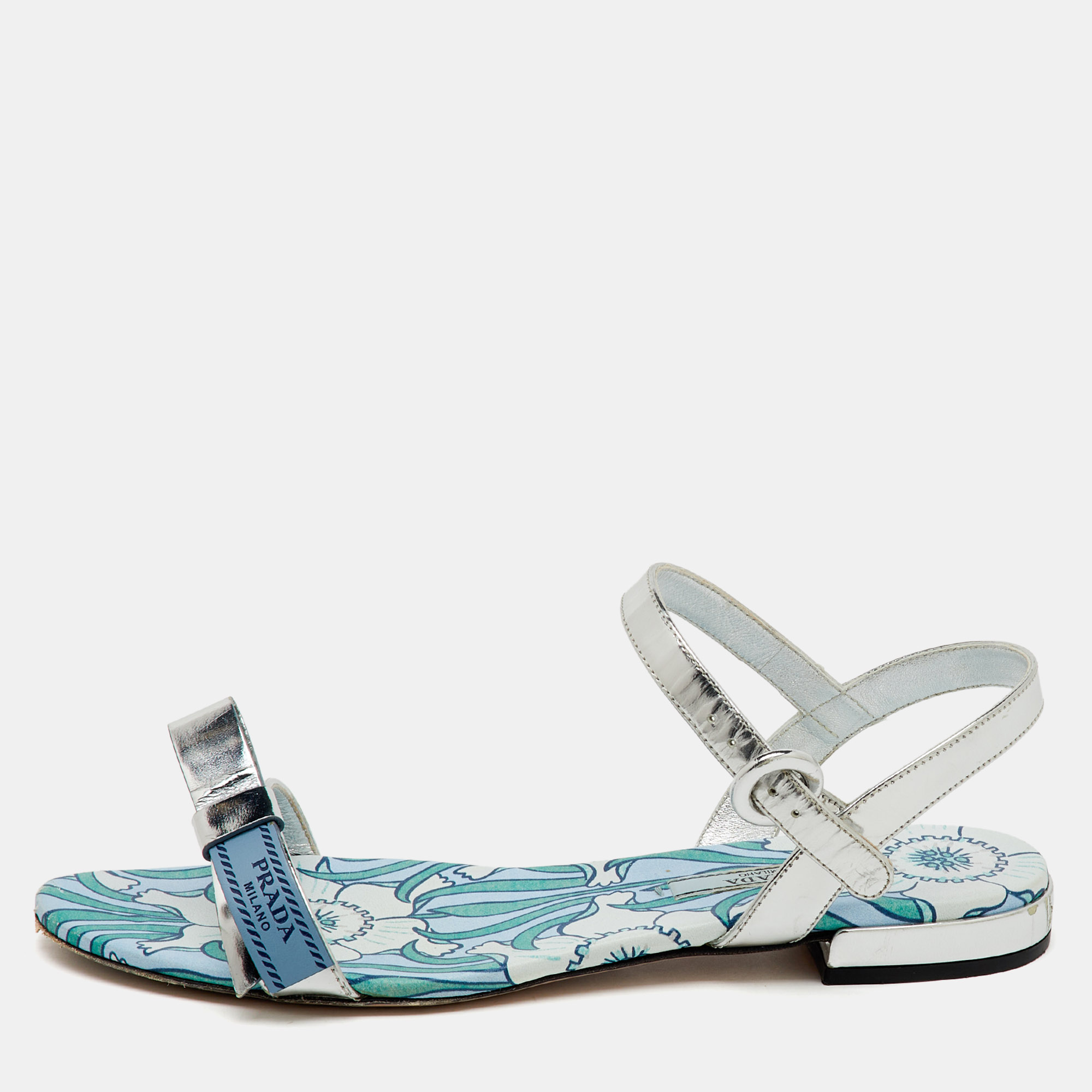 Prada Silver Foil Leather Floral Print Ankle Strap Flat Sandals Size
Prada Silver Foil Leather Floral Print Ankle Strap Flat Sandals Size