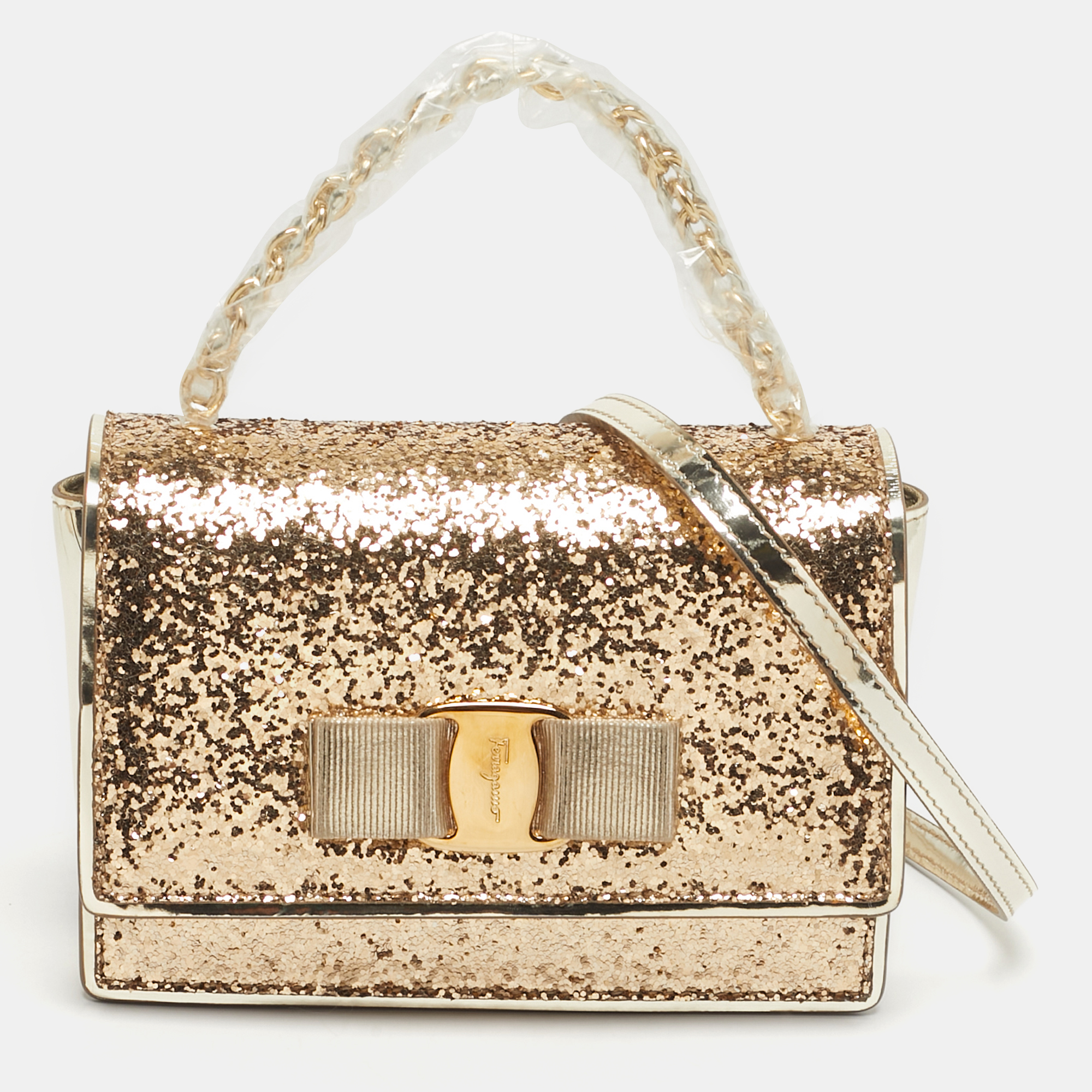 Salvatore Ferragamo Vara Bow Gold Glitter and Patent Leather Top Handle Bag
Salvatore Ferragamo Vara Bow Gold Glitter and Patent Leather Top Handle Bag