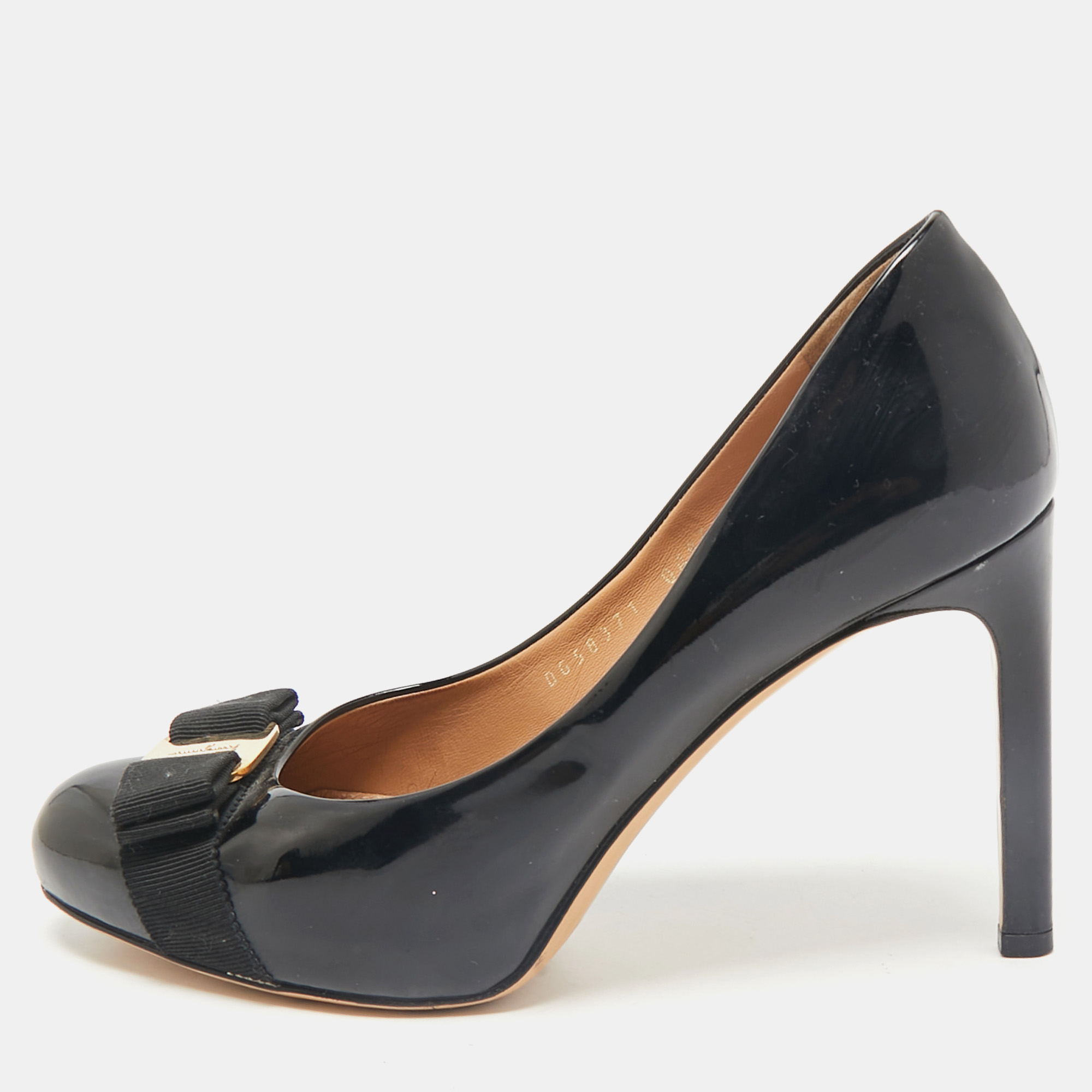 Salvatore Ferragamo Black Patent Leather Vara Bow Pumps Size 37
Salvatore Ferragamo Black Patent Leather Vara Bow Pumps Size 37
