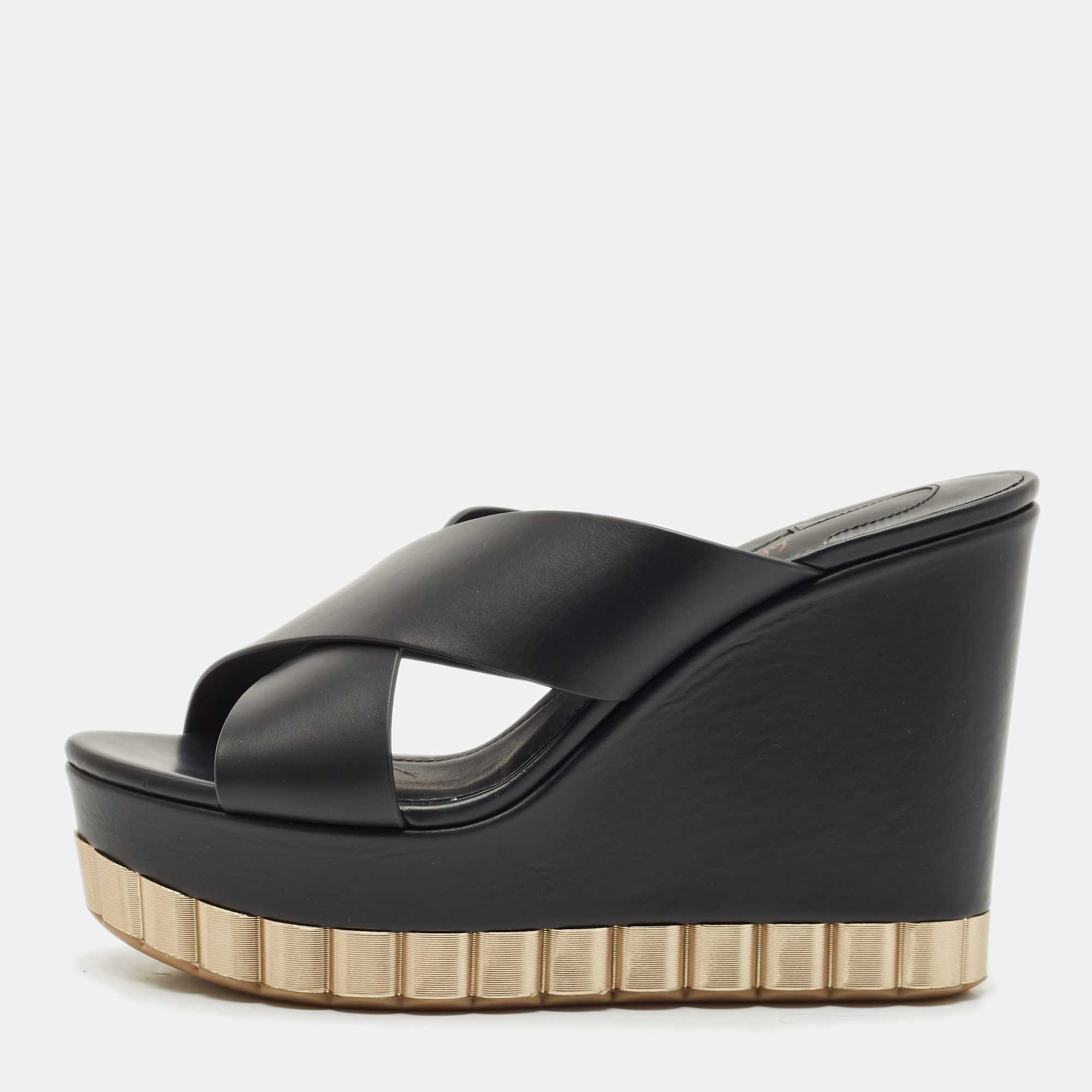 Salvatore Ferragamo Black Leather Nicosia Wedge Sandals Size 37
Salvatore Ferragamo Black Leather Nicosia Wedge Sandals Size 37