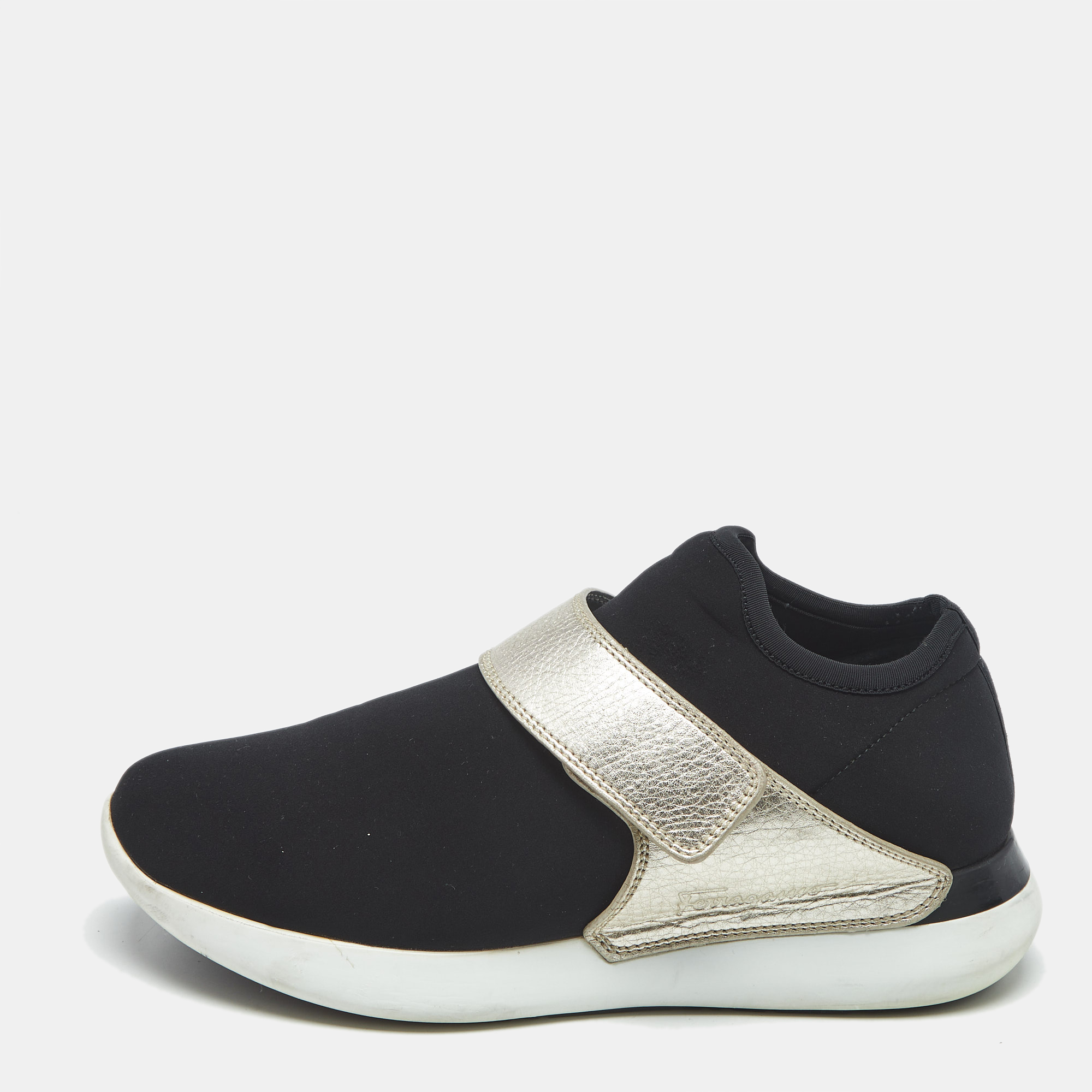 Salvatore Ferragamo Black/Gold Leather and Neoprene Palau Sneakers Size 38.5
Salvatore Ferragamo Black/Gold Leather and Neoprene Palau Sneakers Size 38.5