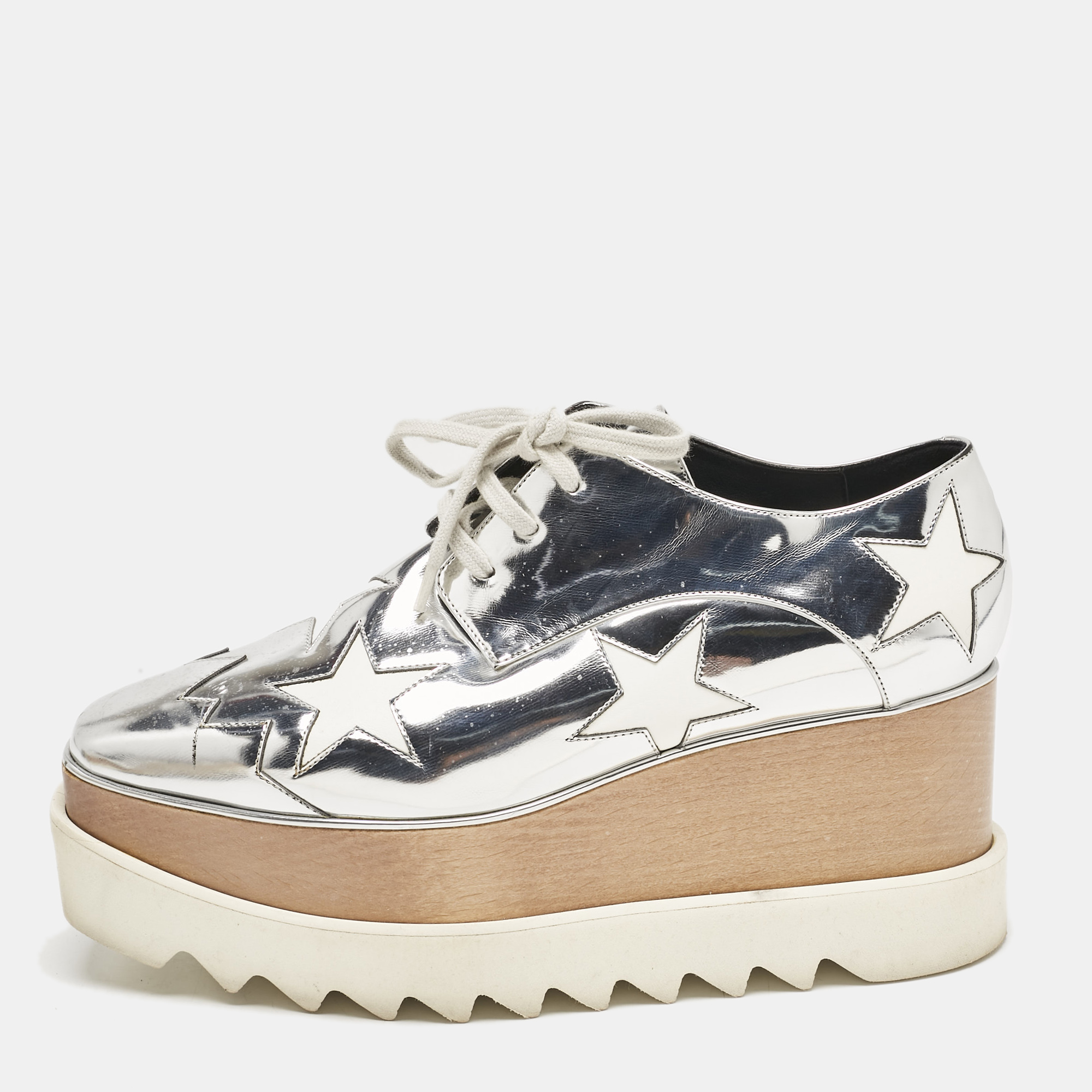 Stella McCartney Silver Faux Leather Elyse Star Platform Sneakers Size
Stella McCartney Silver Faux Leather Elyse Star Platform Sneakers Size