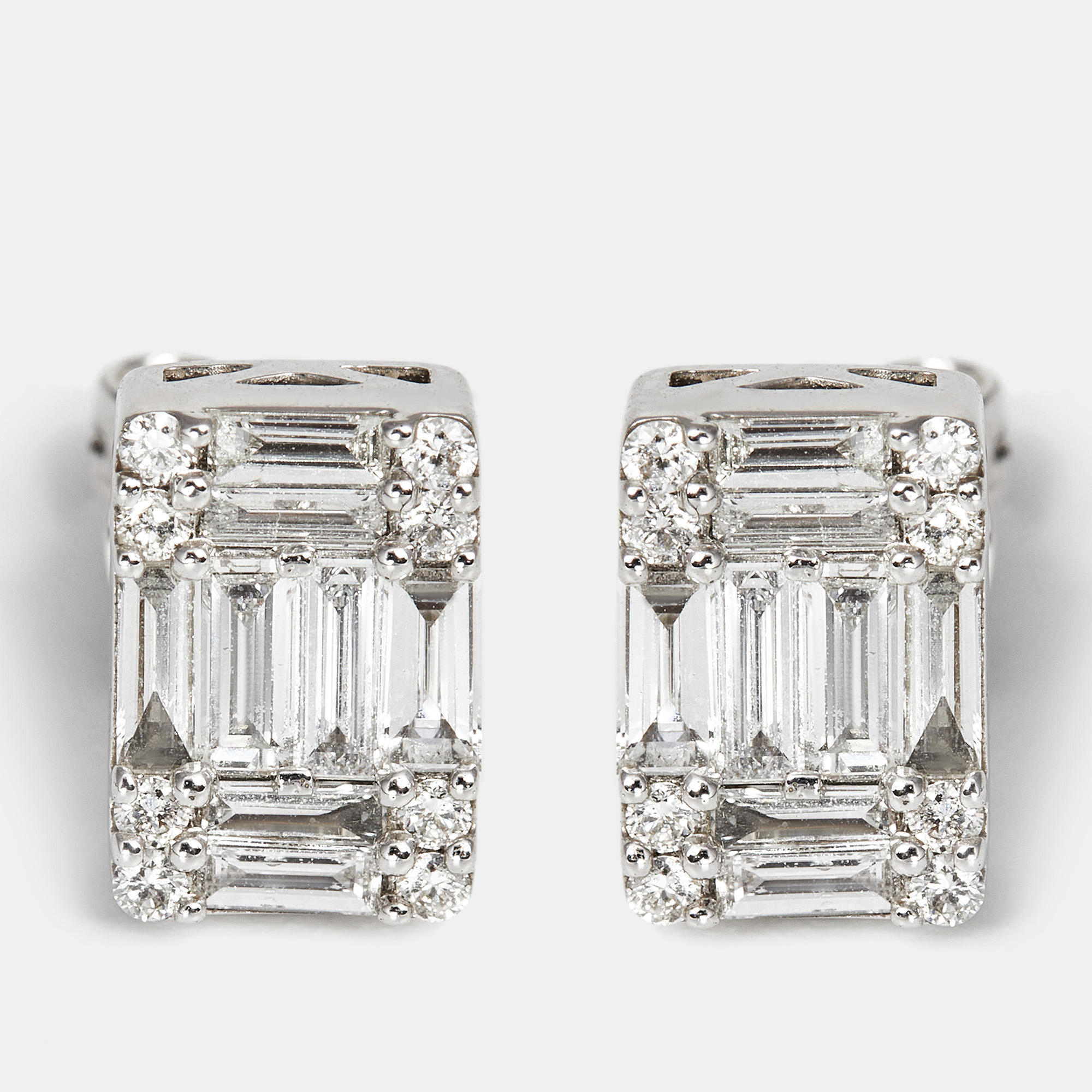 The diamond edit 18k white gold baguette and round cut diamond 0.63 cts 18k white gold stud earrings