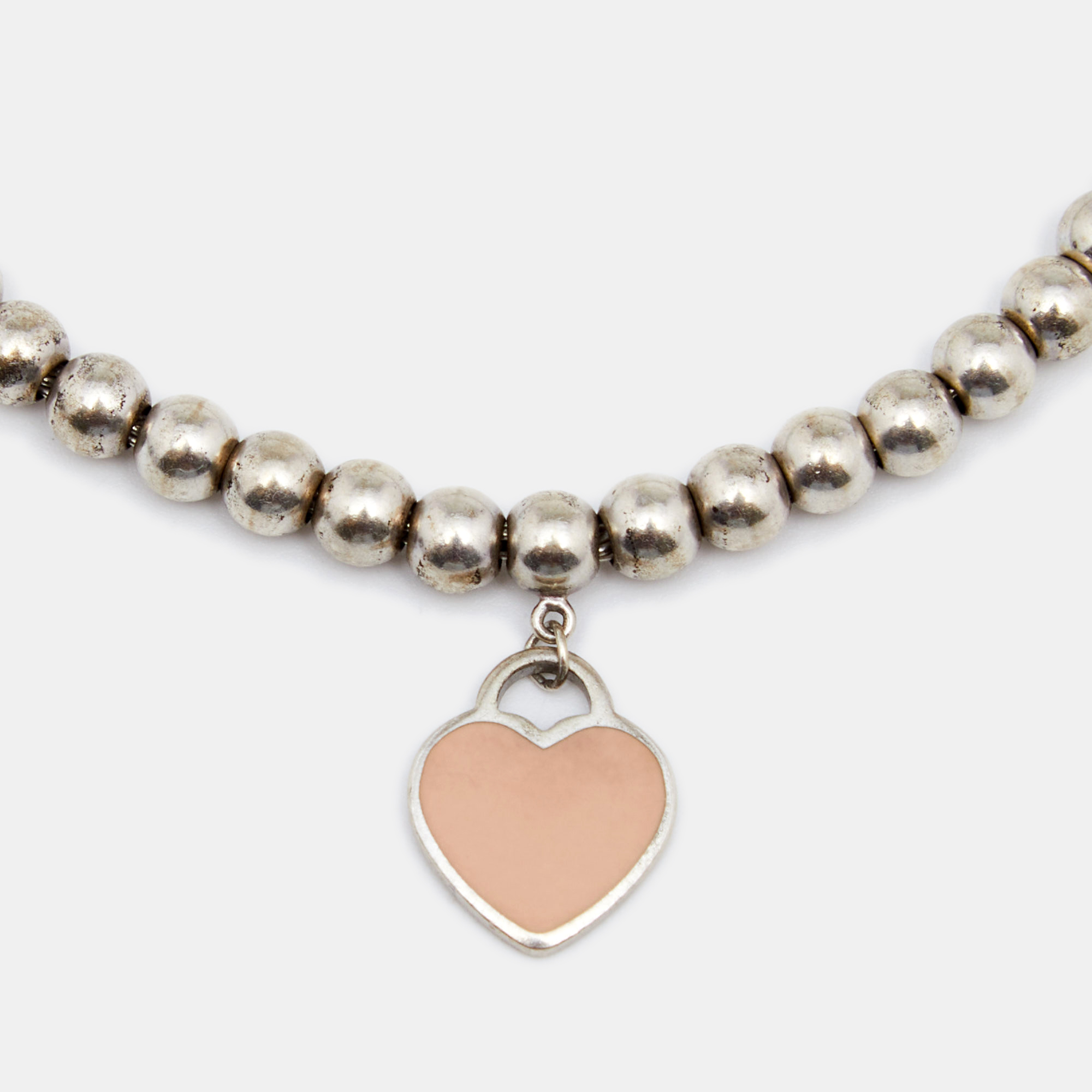 Tiffany & Co. Return to Tiffany Pink Enamel Heart Tag Silver Bead Bracelet
Tiffany & Co. Return to Tiffany Pink Enamel Heart Tag Silver Bead Bracelet