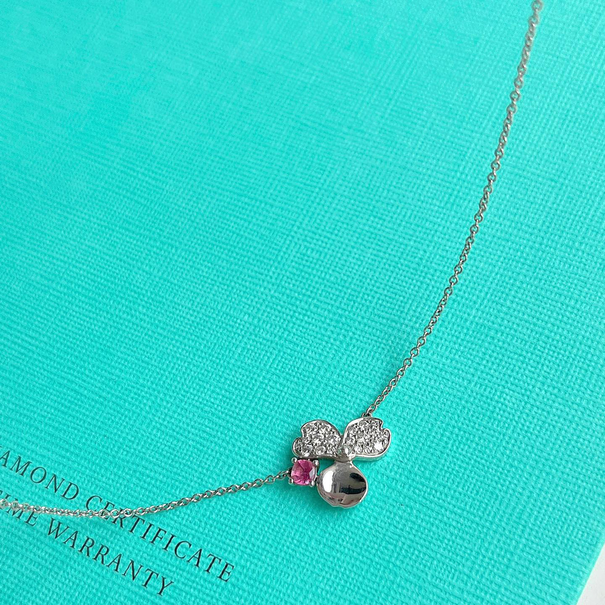 Tiffany & Co. 18K White Gold Diamond Pink Tourmaline Paper Flower Necklace
Tiffany & Co. 18K White Gold Diamond Pink Tourmaline Paper Flower Necklace
