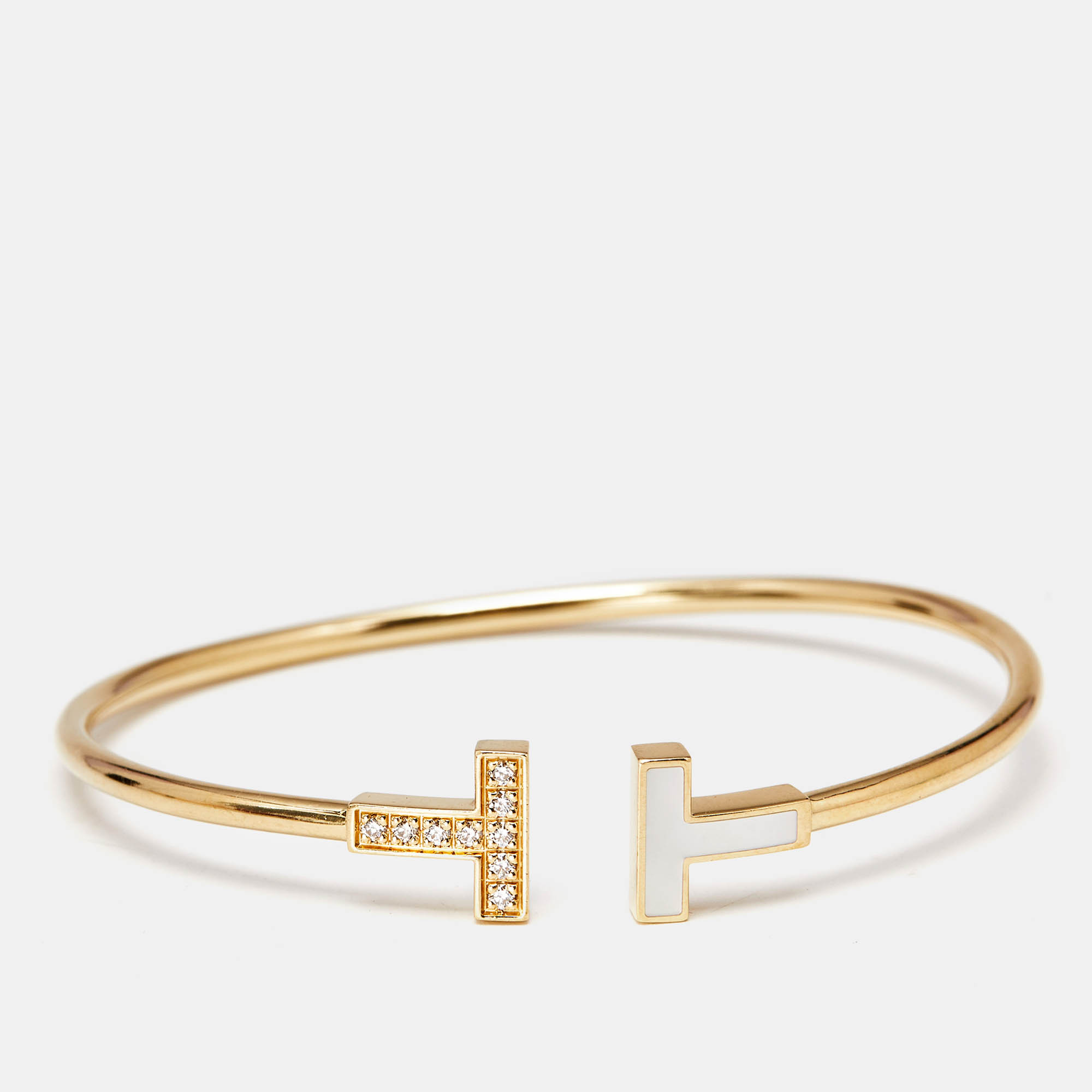 Tiffany & Co. Tiffany T Diamond Mother of Pearl 18k Yellow Gold Bracelet
Tiffany & Co. Tiffany T Diamond Mother of Pearl 18k Yellow Gold Bracelet