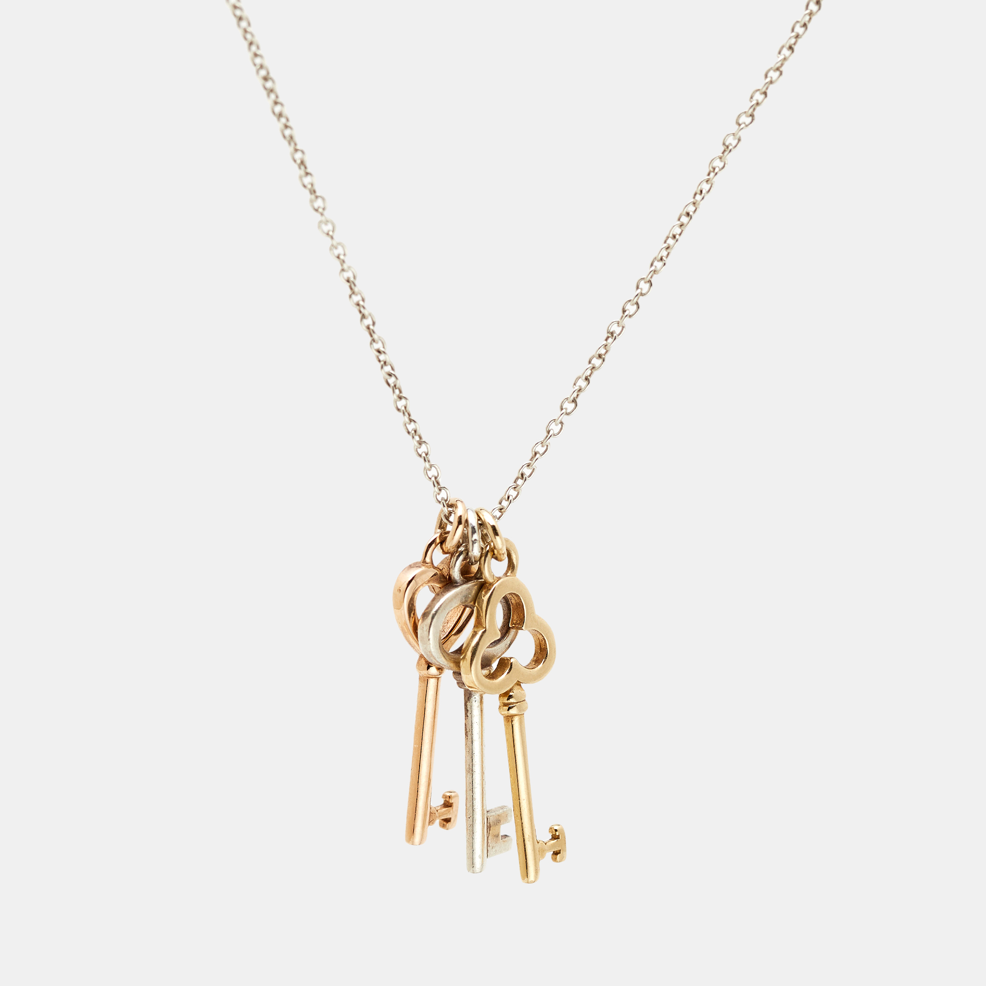 Tiffany & Co. Three Key 18k Two Tone Gold Sterling Silver Pendant Necklace
Tiffany & Co. Three Key 18k Two Tone Gold Sterling Silver Pendant Necklace