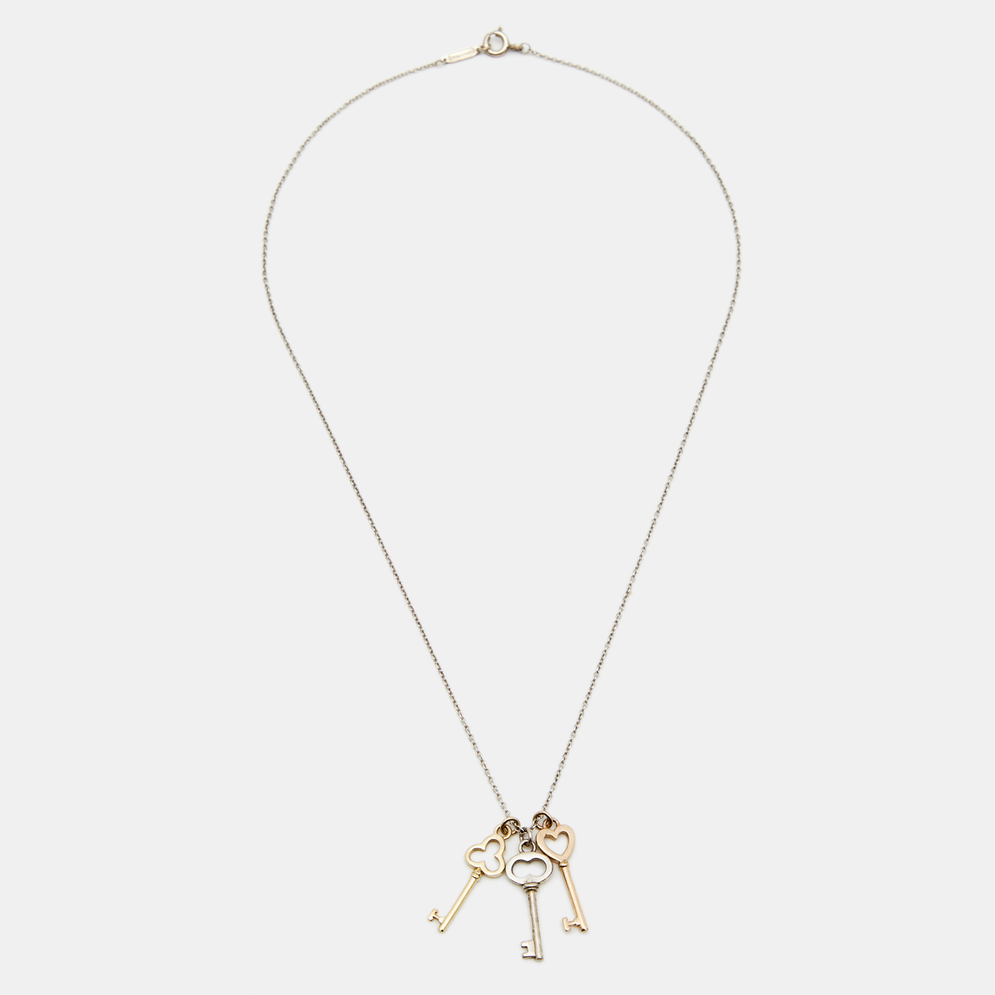 Tiffany & Co. Three Key 18k Two Tone Gold Sterling Silver Pendant Necklace
Tiffany & Co. Three Key 18k Two Tone Gold Sterling Silver Pendant Necklace