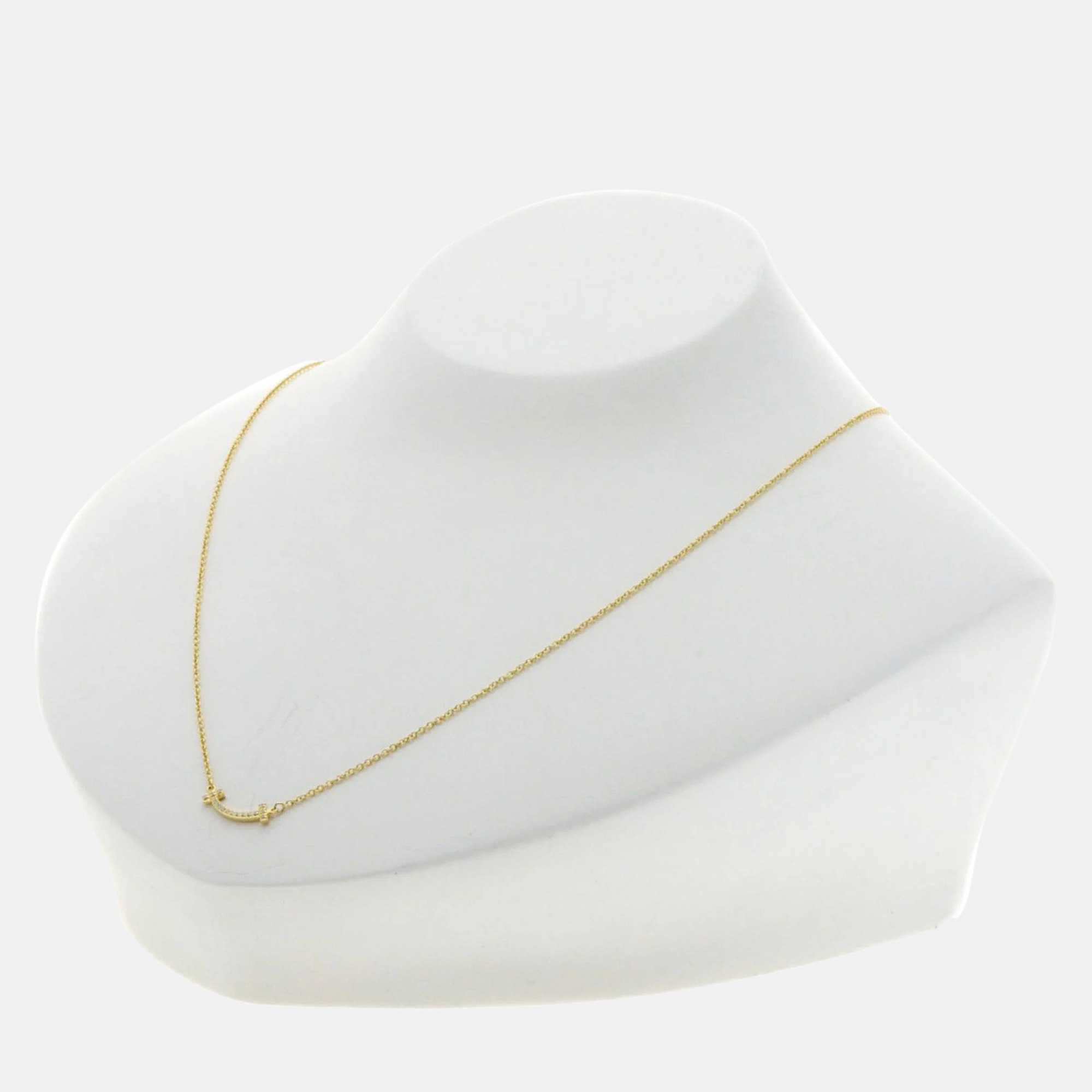 Tiffany & Co. 18K Yellow Gold and Diamond T Smile Pendant Necklace
Tiffany & Co. 18K Yellow Gold and Diamond T Smile Pendant Necklace